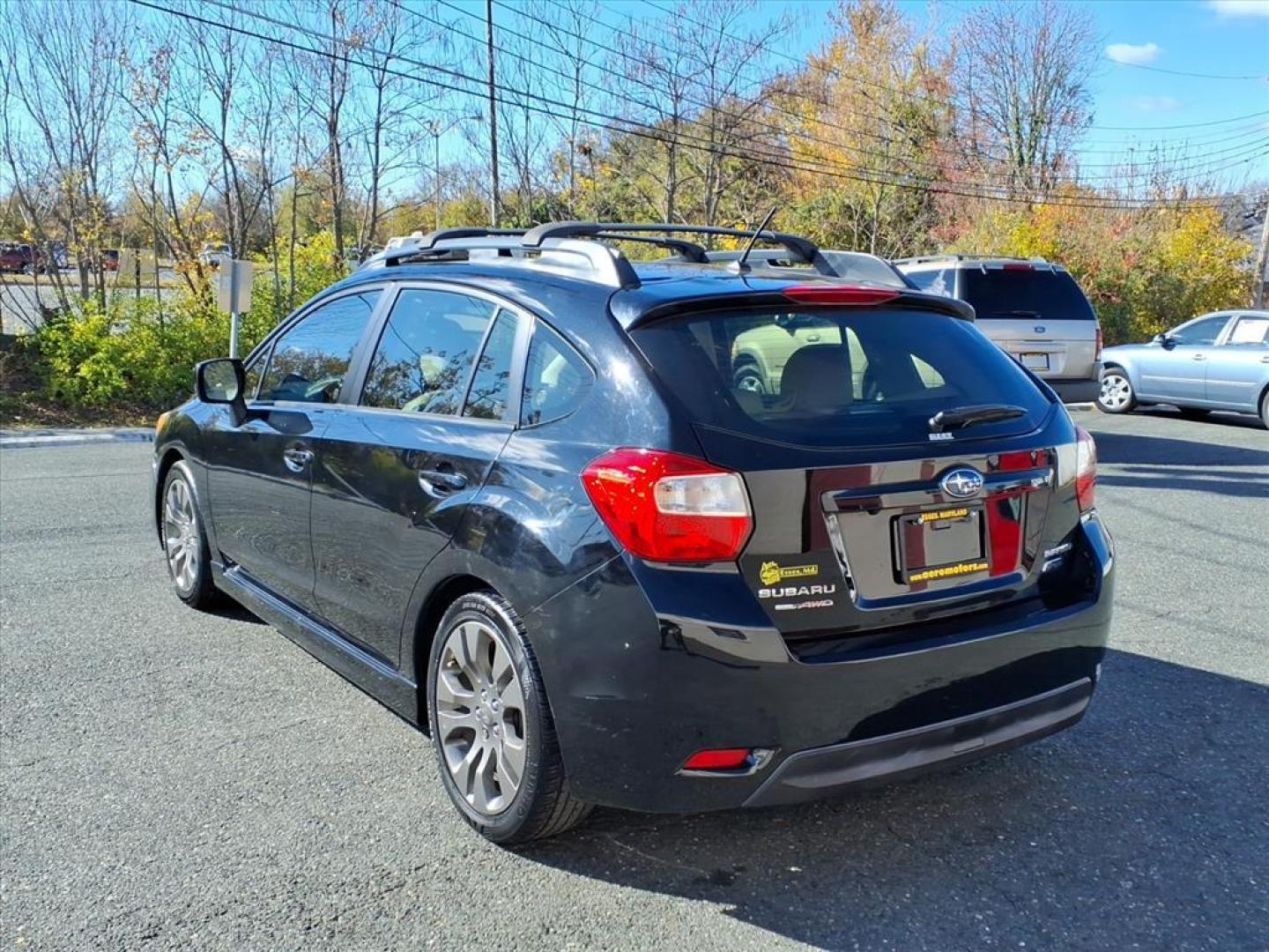 2014 Crystal Black Silica Subaru Impreza 2.0i Sport Limited (JF1GPAS62E8) with an 2.0L 2.0L H4 148hp 145ft. lbs. Sequential-Port F.I. engine, CVT transmission, located at 50 Eastern Blvd., Essex, MD, 21221, (410) 686-3444, 39.304367, -76.484947 - Photo#2