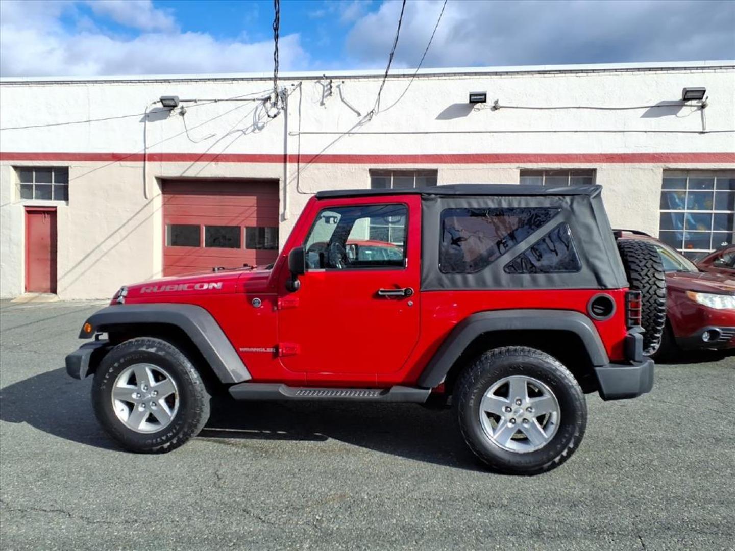 2007 Flame Red Clearcoat Jeep Wrangler Rubicon (1J4GA64187L) with an 3.8L 6 Cylinder Sequential-Port F.I. engine, V6 AT 4X4 transmission, located at 50 Eastern Blvd., Essex, MD, 21221, (410) 686-3444, 39.304367, -76.484947 - Photo#1
