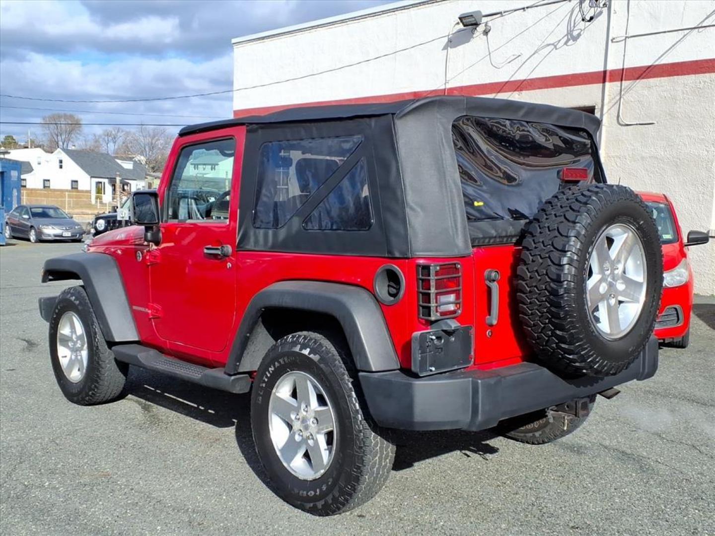 2007 Flame Red Clearcoat Jeep Wrangler Rubicon (1J4GA64187L) with an 3.8L 6 Cylinder Sequential-Port F.I. engine, V6 AT 4X4 transmission, located at 50 Eastern Blvd., Essex, MD, 21221, (410) 686-3444, 39.304367, -76.484947 - Photo#2