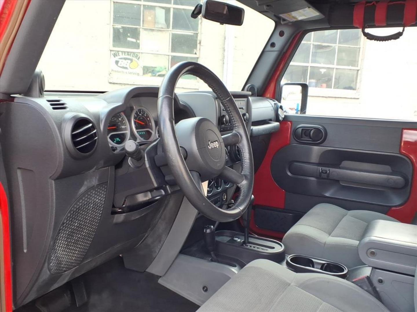 2007 Flame Red Clearcoat Jeep Wrangler Rubicon (1J4GA64187L) with an 3.8L 6 Cylinder Sequential-Port F.I. engine, V6 AT 4X4 transmission, located at 50 Eastern Blvd., Essex, MD, 21221, (410) 686-3444, 39.304367, -76.484947 - Photo#10