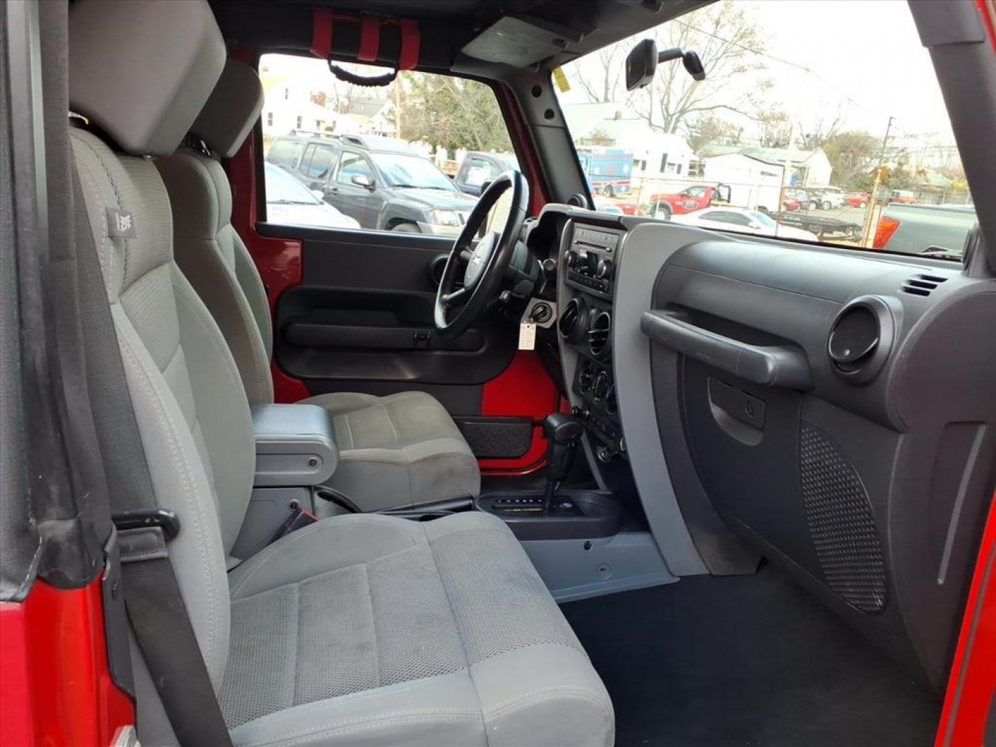 2007 Flame Red Clearcoat Jeep Wrangler Rubicon (1J4GA64187L) with an 3.8L 6 Cylinder Sequential-Port F.I. engine, V6 AT 4X4 transmission, located at 50 Eastern Blvd., Essex, MD, 21221, (410) 686-3444, 39.304367, -76.484947 - Photo#13