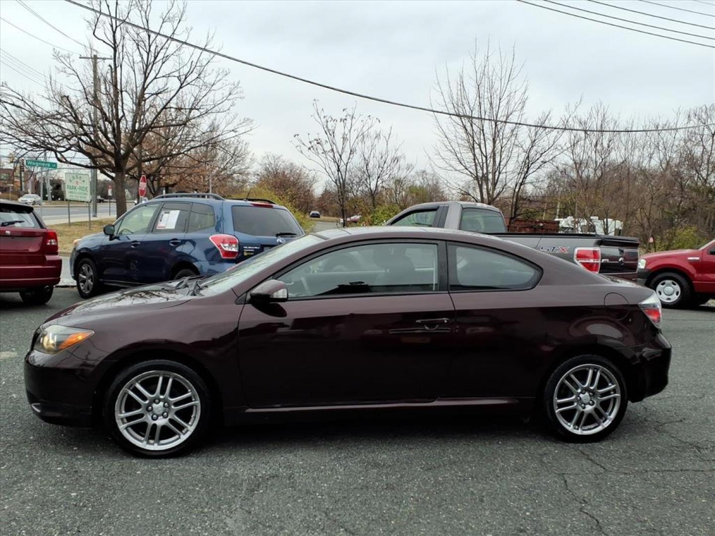 2009 Sizzling Crimson Mica Scion tC Base (JTKDE167390) with an 2.4L 2.4L I4 161hp 162ft. lbs. Fuel Injected engine, 4-Speed Automatic transmission, located at 50 Eastern Blvd., Essex, MD, 21221, (410) 686-3444, 39.304367, -76.484947 - Photo#1