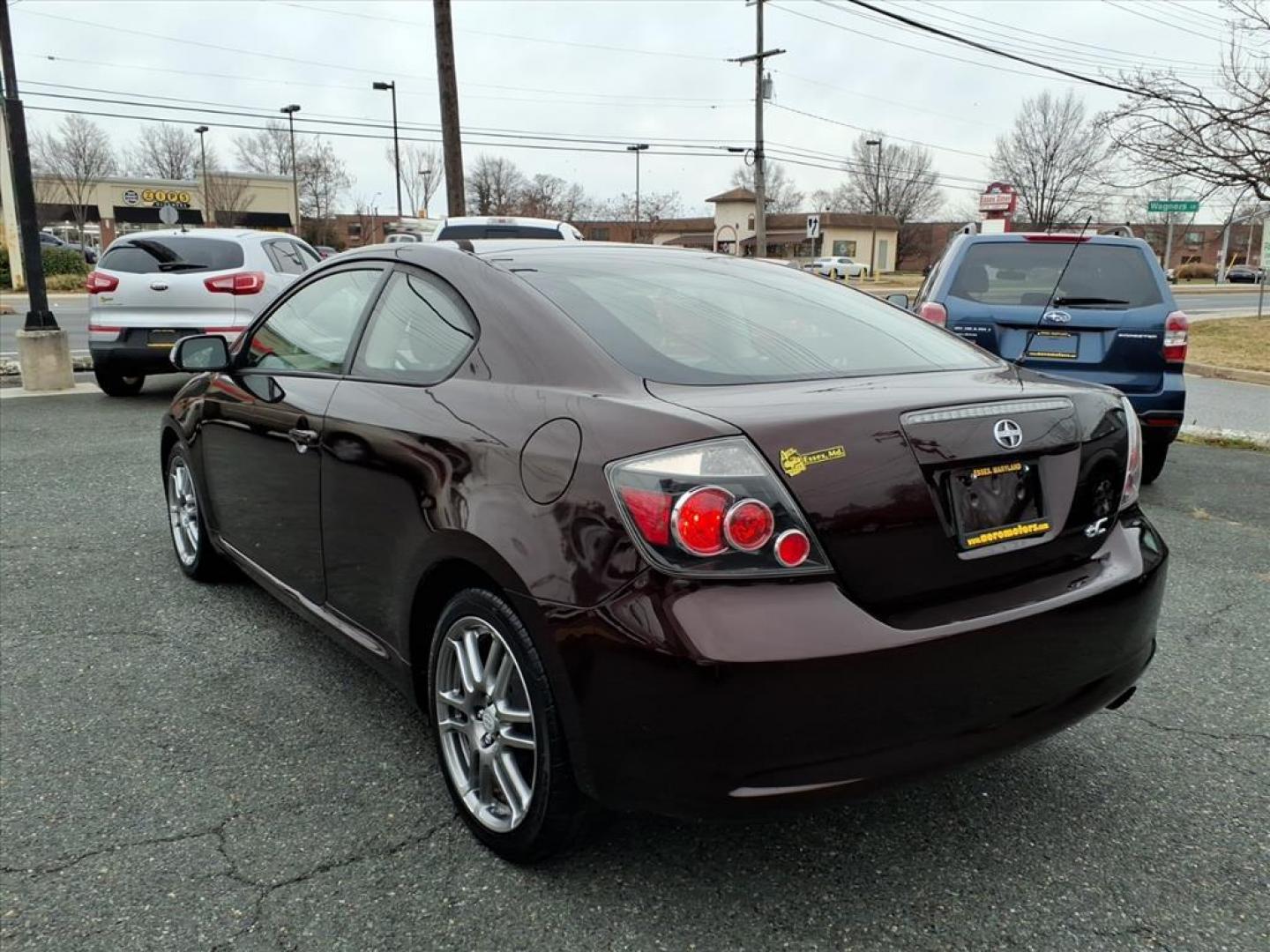 2009 Sizzling Crimson Mica Scion tC Base (JTKDE167390) with an 2.4L 2.4L I4 161hp 162ft. lbs. Fuel Injected engine, 4-Speed Automatic transmission, located at 50 Eastern Blvd., Essex, MD, 21221, (410) 686-3444, 39.304367, -76.484947 - Photo#2