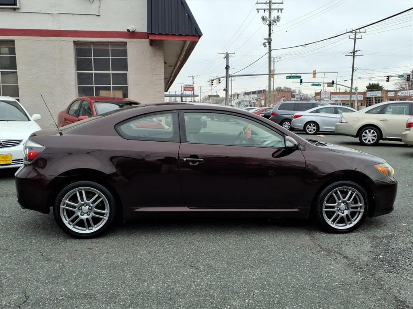 2009 Sizzling Crimson Mica Scion tC Base (JTKDE167390) with an 2.4L 2.4L I4 161hp 162ft. lbs. Fuel Injected engine, 4-Speed Automatic transmission, located at 50 Eastern Blvd., Essex, MD, 21221, (410) 686-3444, 39.304367, -76.484947 - Photo#5