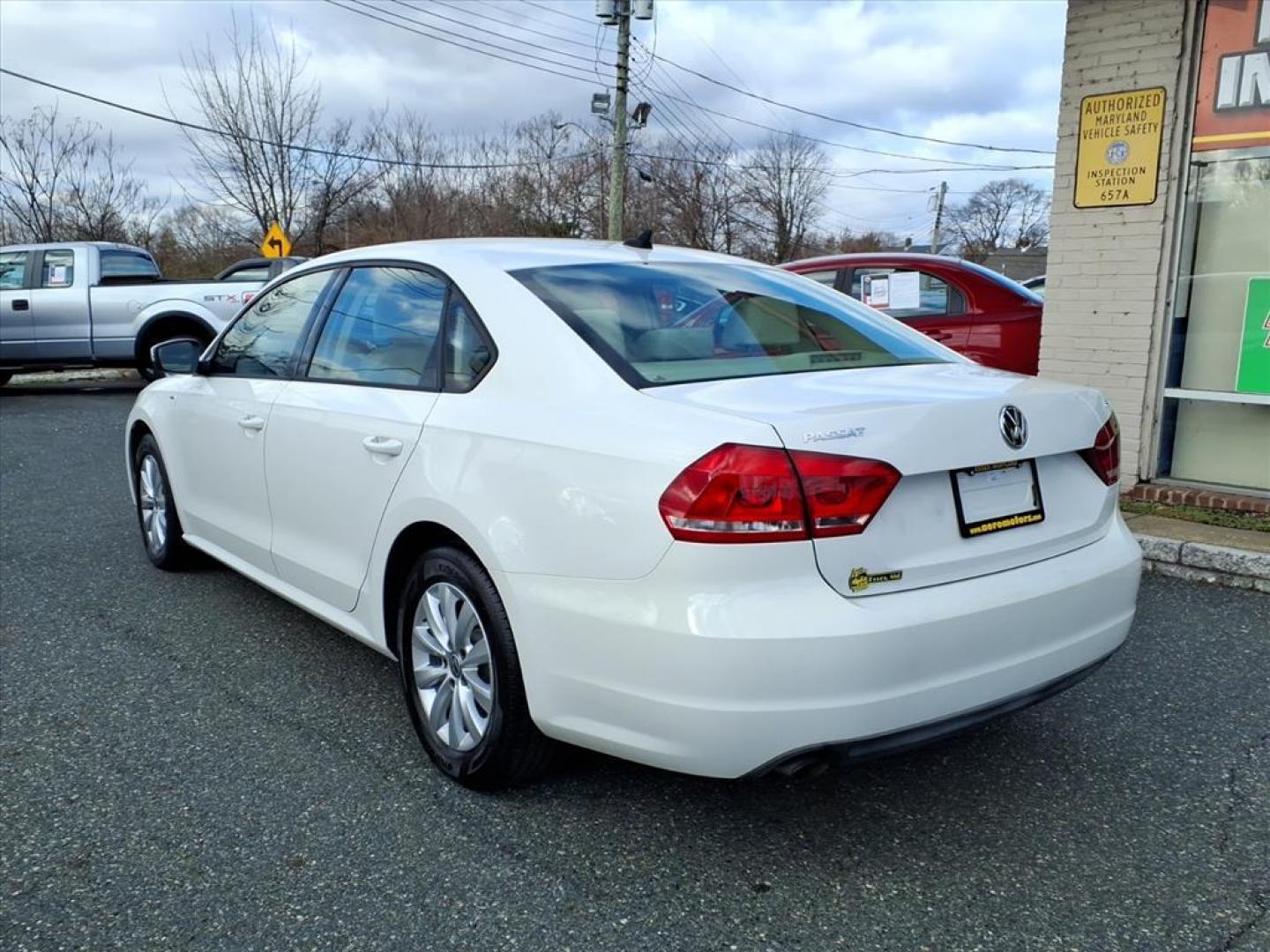 2014 Candy White Volkswagen Passat 1.8T Wolfsburg Edition (1VWAS7A30EC) with an 1.8L 1.8L Turbo I4 170hp 184ft. lbs. Turbocharged engine, 6-Speed Shiftable Automatic transmission, located at 50 Eastern Blvd., Essex, MD, 21221, (410) 686-3444, 39.304367, -76.484947 - Photo#2