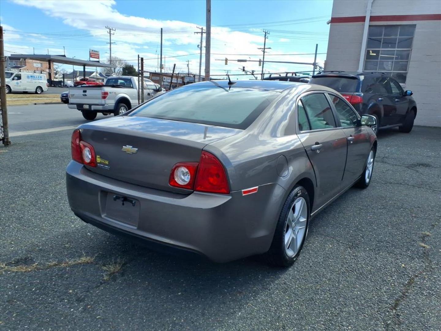 2011 Mocha Steel Metallic Chevrolet Malibu LS (1G1ZB5E11BF) with an 2.4L 4 Cylinder Sequential-Port F.I. engine, 4CYL transmission, located at 50 Eastern Blvd., Essex, MD, 21221, (410) 686-3444, 39.304367, -76.484947 - Photo#4