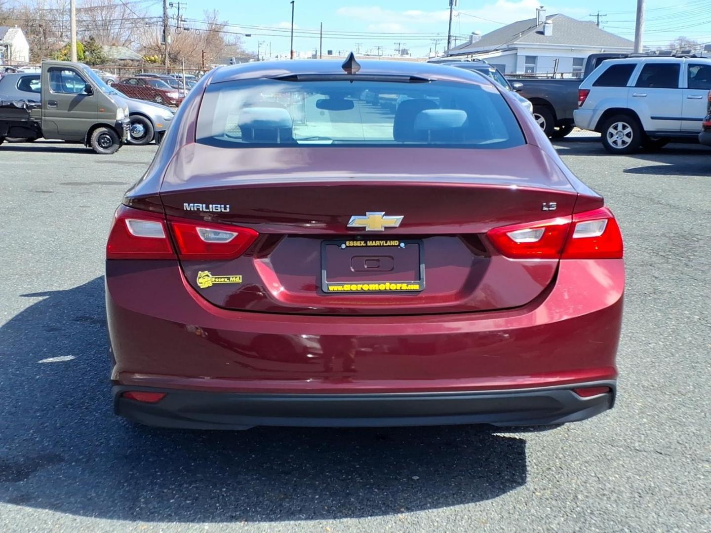 2016 Red Chevrolet Malibu LS (1G1ZB5ST8GF) with an 1.5L 4 Cylinder Turbocharged engine, 4CYL transmission, located at 50 Eastern Blvd., Essex, MD, 21221, (410) 686-3444, 39.304367, -76.484947 - Photo#3
