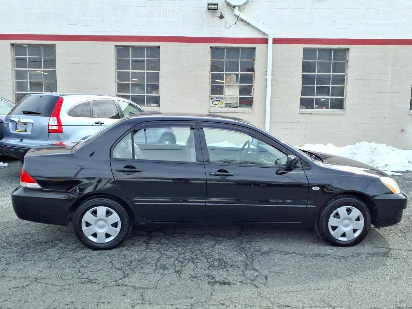 2005 Black Mitsubishi Lancer ES (JA3AJ26E75U) with an 2.0L 4 Cylinder Fuel Injected engine, Automatic transmission, located at 50 Eastern Blvd., Essex, MD, 21221, (410) 686-3444, 39.304367, -76.484947 - Photo#1