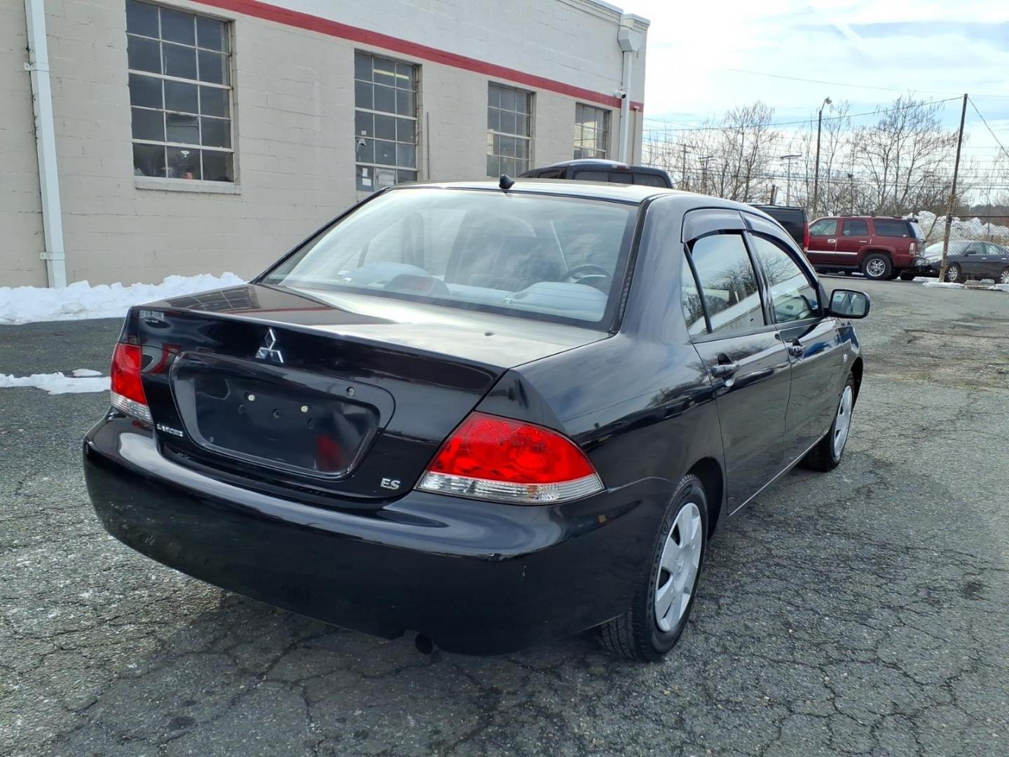 2005 Black Mitsubishi Lancer ES (JA3AJ26E75U) with an 2.0L 4 Cylinder Fuel Injected engine, Automatic transmission, located at 50 Eastern Blvd., Essex, MD, 21221, (410) 686-3444, 39.304367, -76.484947 - Photo#2
