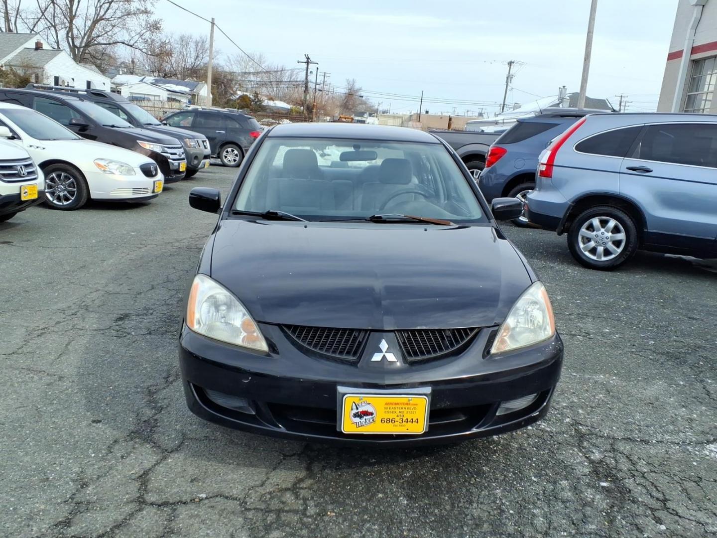 2005 Black Mitsubishi Lancer ES (JA3AJ26E75U) with an 2.0L 4 Cylinder Fuel Injected engine, Automatic transmission, located at 50 Eastern Blvd., Essex, MD, 21221, (410) 686-3444, 39.304367, -76.484947 - Photo#4