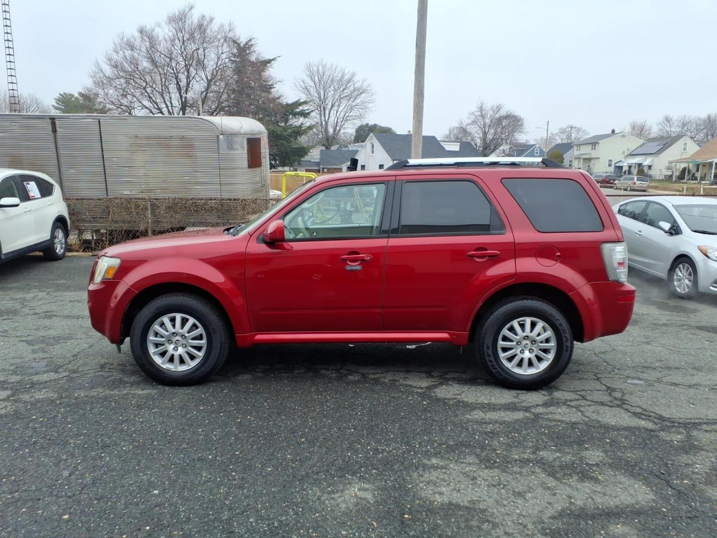 2010 Red Mercury Mariner Premier I4 (4M2CN8H73AK) with an 2.5L Duratec 2.5L I4 171hp 171ft. lbs. Sequential-Port F.I. engine, 6-Speed Automatic transmission, located at 50 Eastern Blvd., Essex, MD, 21221, (410) 686-3444, 39.304367, -76.484947 - Photo#1
