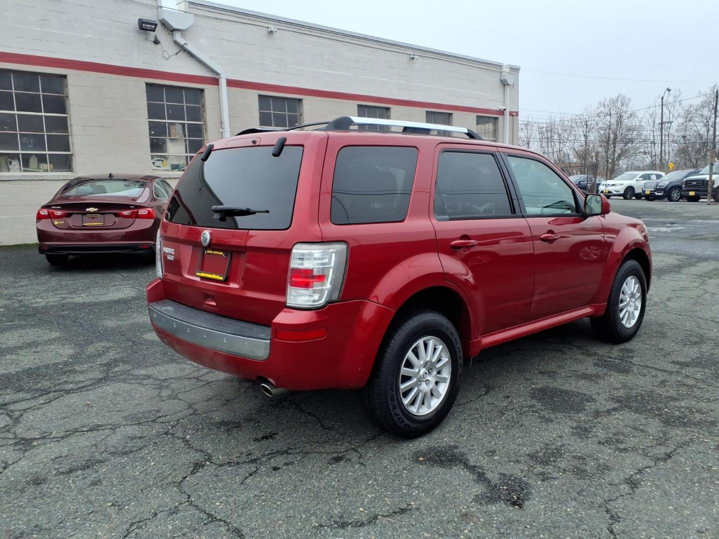 2010 Red Mercury Mariner Premier I4 (4M2CN8H73AK) with an 2.5L Duratec 2.5L I4 171hp 171ft. lbs. Sequential-Port F.I. engine, 6-Speed Automatic transmission, located at 50 Eastern Blvd., Essex, MD, 21221, (410) 686-3444, 39.304367, -76.484947 - Photo#4