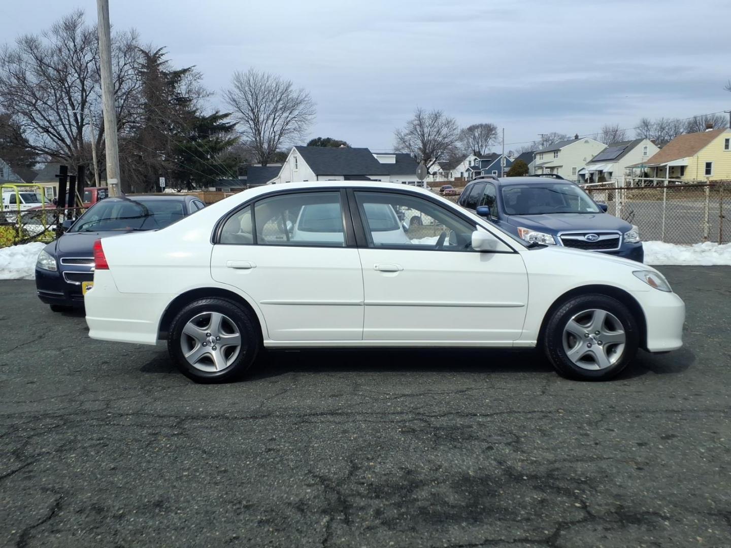 2004 White Honda Civic (2HGES257X4H) with an 1.7L 4 Cylinder Fuel Injected engine, Automatic transmission, located at 50 Eastern Blvd., Essex, MD, 21221, (410) 686-3444, 39.304367, -76.484947 - Photo#5