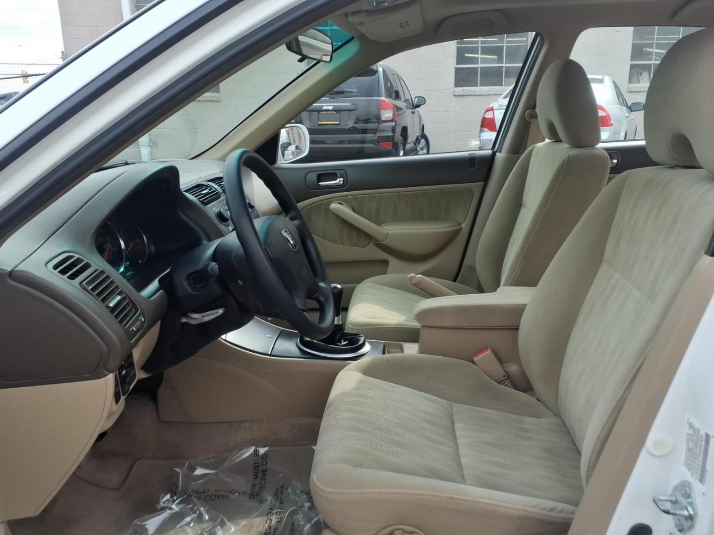 2004 White Honda Civic (2HGES257X4H) with an 1.7L 4 Cylinder Fuel Injected engine, Automatic transmission, located at 50 Eastern Blvd., Essex, MD, 21221, (410) 686-3444, 39.304367, -76.484947 - Photo#7