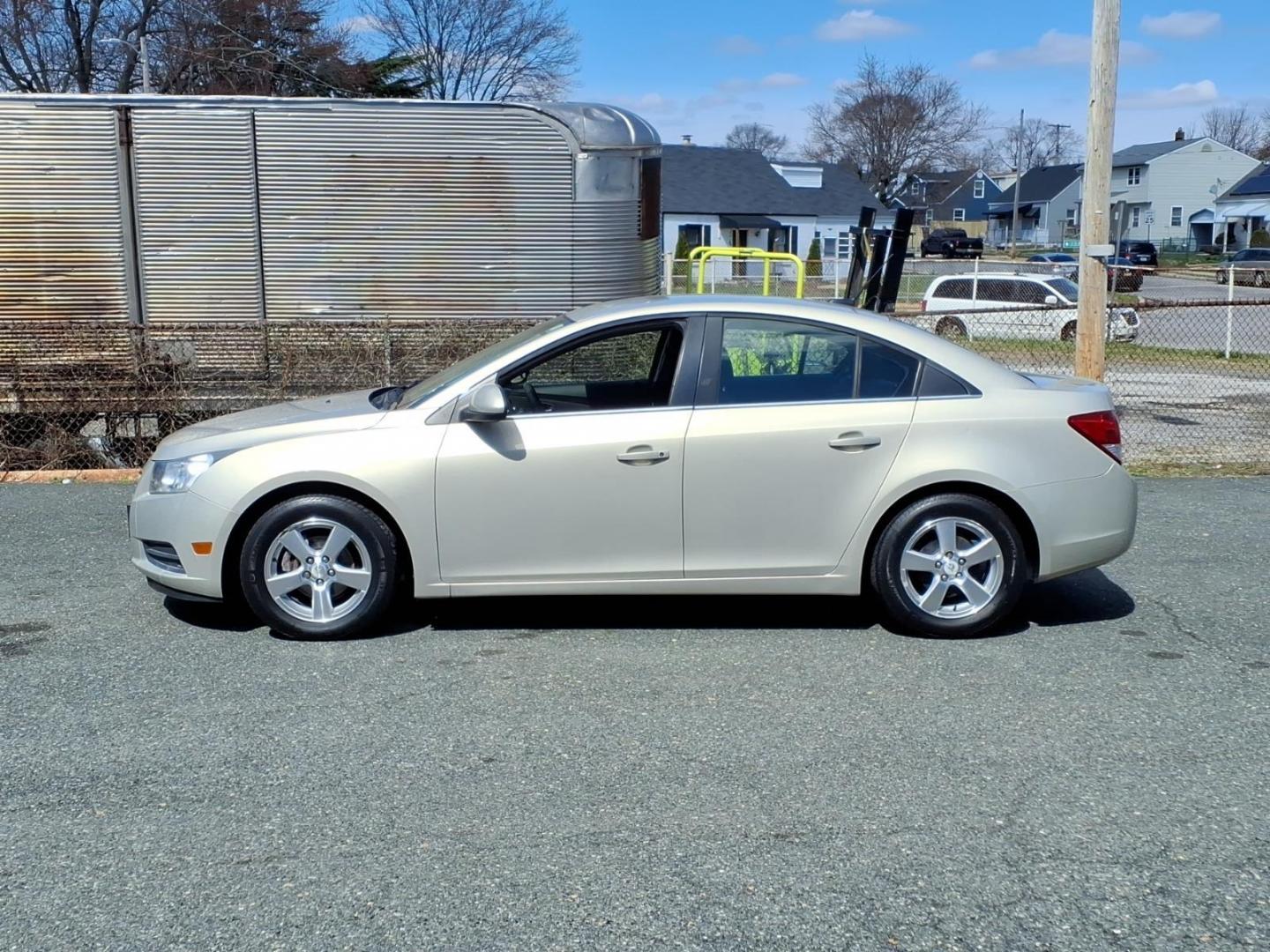 2012 Gold Chevrolet Cruze LT (1G1PF5SC6C7) with an 1.4L Ecotec 1.4L Turbo I4 138hp 148ft. lbs. Sequential-Port F.I. engine, 6-Speed Shiftable Automatic transmission, located at 50 Eastern Blvd., Essex, MD, 21221, (410) 686-3444, 39.304367, -76.484947 - Photo#1