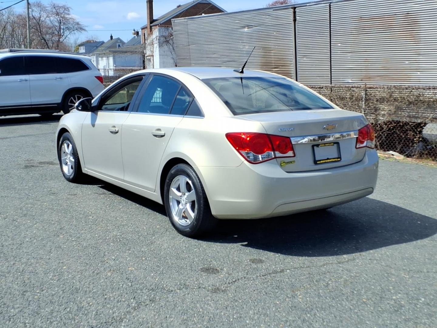 2012 Gold Chevrolet Cruze LT (1G1PF5SC6C7) with an 1.4L Ecotec 1.4L Turbo I4 138hp 148ft. lbs. Sequential-Port F.I. engine, 6-Speed Shiftable Automatic transmission, located at 50 Eastern Blvd., Essex, MD, 21221, (410) 686-3444, 39.304367, -76.484947 - Photo#2