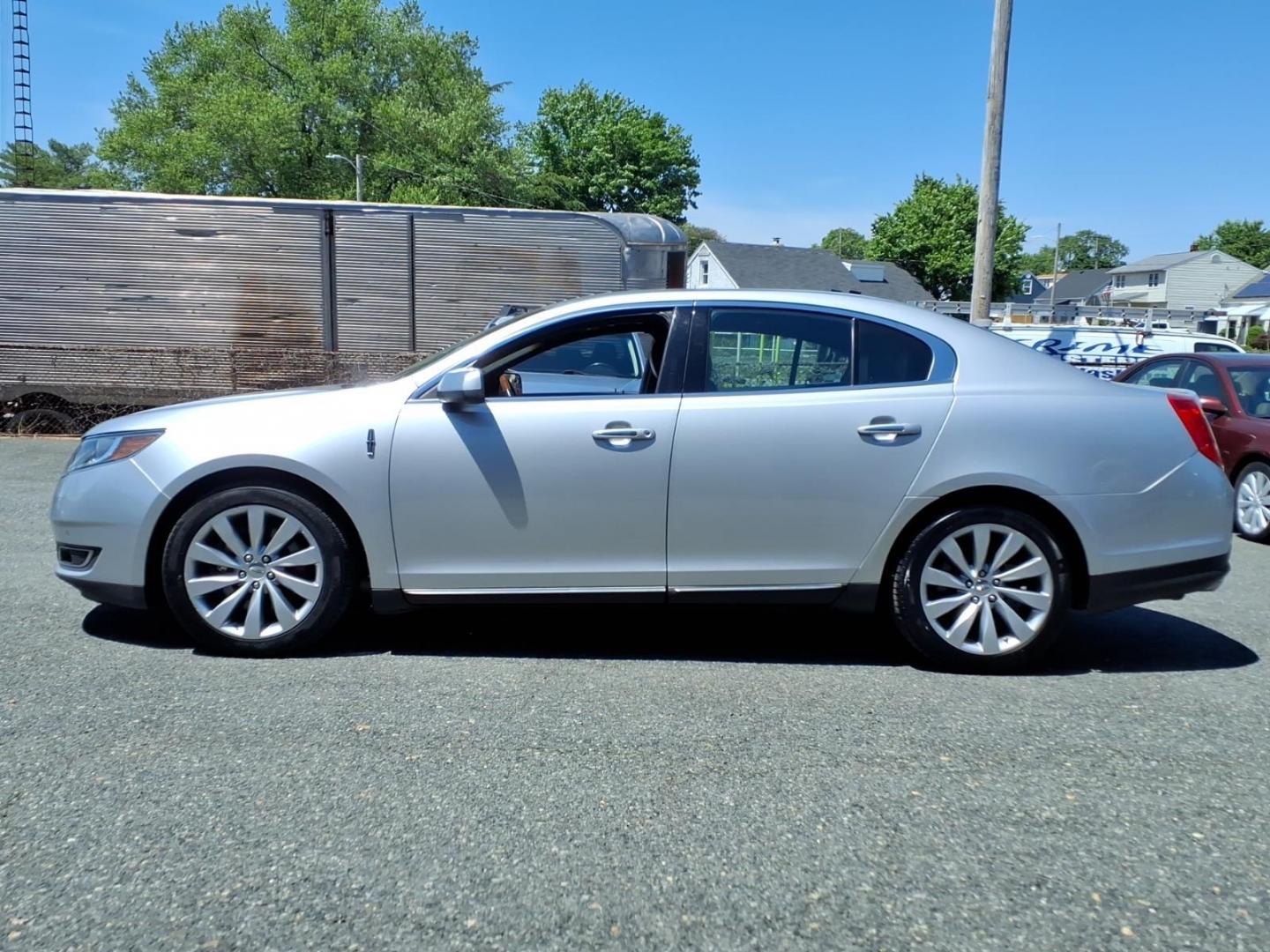 2013 Silver Lincoln MKS Base (1LNHL9DK1DG) with an 3.7L 6 Cylinder Sequential-Port F.I. engine, V6 transmission, located at 50 Eastern Blvd., Essex, MD, 21221, (410) 686-3444, 39.304367, -76.484947 - Photo#1