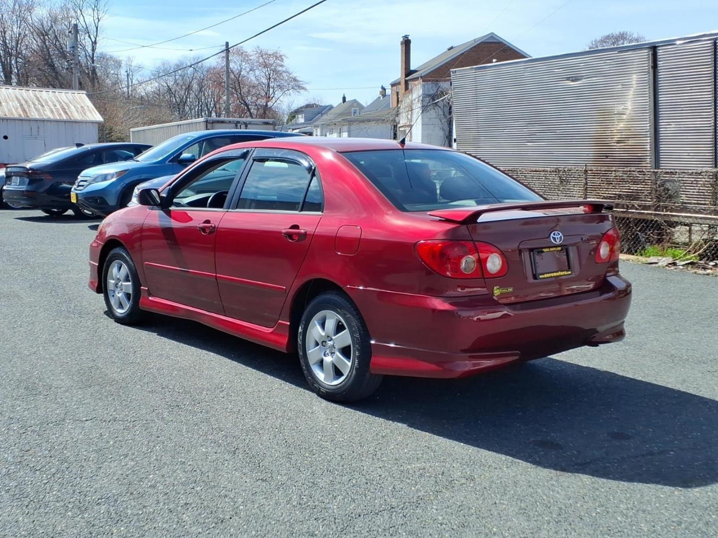 2006 Red Toyota Corolla CE (1NXBR32E16Z) with an 1.8L 1L NA I4 double overhead cam (DOHC) 16V Fuel Injected engine, 4-Speed Automatic transmission, located at 50 Eastern Blvd., Essex, MD, 21221, (410) 686-3444, 39.304367, -76.484947 - Photo#2