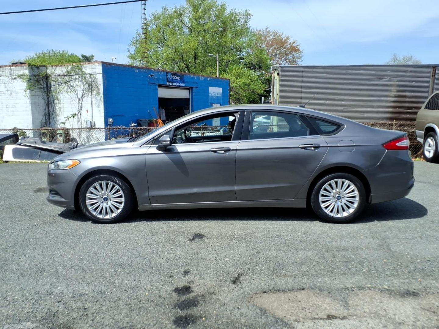 2013 Gray Ford Fusion Hybrid SE (3FA6P0LU0DR) with an 2.0L 4 Cylinder Sequential-Port F.I. engine, 4CYL transmission, located at 50 Eastern Blvd., Essex, MD, 21221, (410) 686-3444, 39.304367, -76.484947 - Photo#1