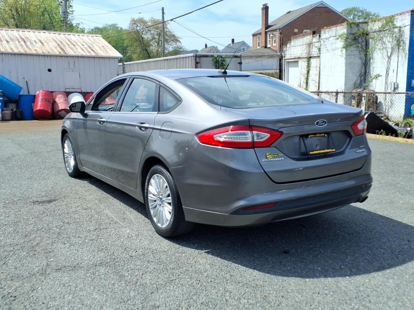 2013 Gray Ford Fusion Hybrid SE (3FA6P0LU0DR) with an 2.0L 4 Cylinder Sequential-Port F.I. engine, 4CYL transmission, located at 50 Eastern Blvd., Essex, MD, 21221, (410) 686-3444, 39.304367, -76.484947 - Photo#2