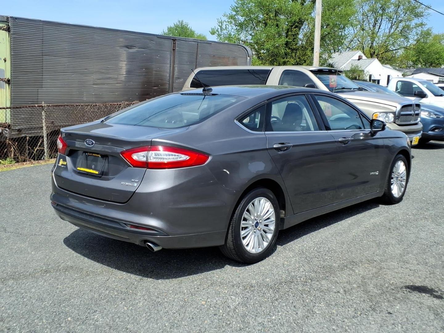 2013 Gray Ford Fusion Hybrid SE (3FA6P0LU0DR) with an 2.0L 4 Cylinder Sequential-Port F.I. engine, 4CYL transmission, located at 50 Eastern Blvd., Essex, MD, 21221, (410) 686-3444, 39.304367, -76.484947 - Photo#4