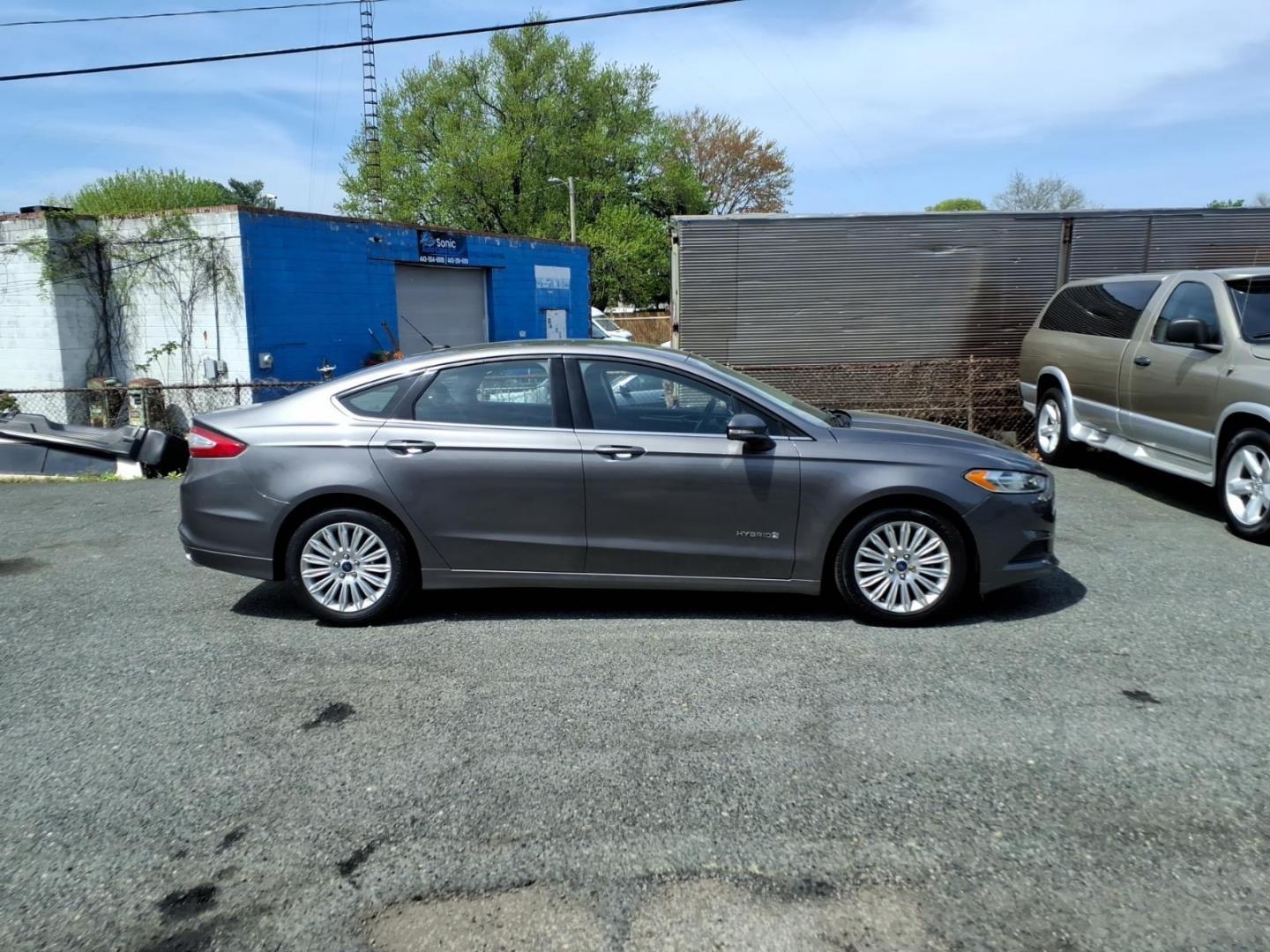2013 Gray Ford Fusion Hybrid SE (3FA6P0LU0DR) with an 2.0L 4 Cylinder Sequential-Port F.I. engine, 4CYL transmission, located at 50 Eastern Blvd., Essex, MD, 21221, (410) 686-3444, 39.304367, -76.484947 - Photo#5