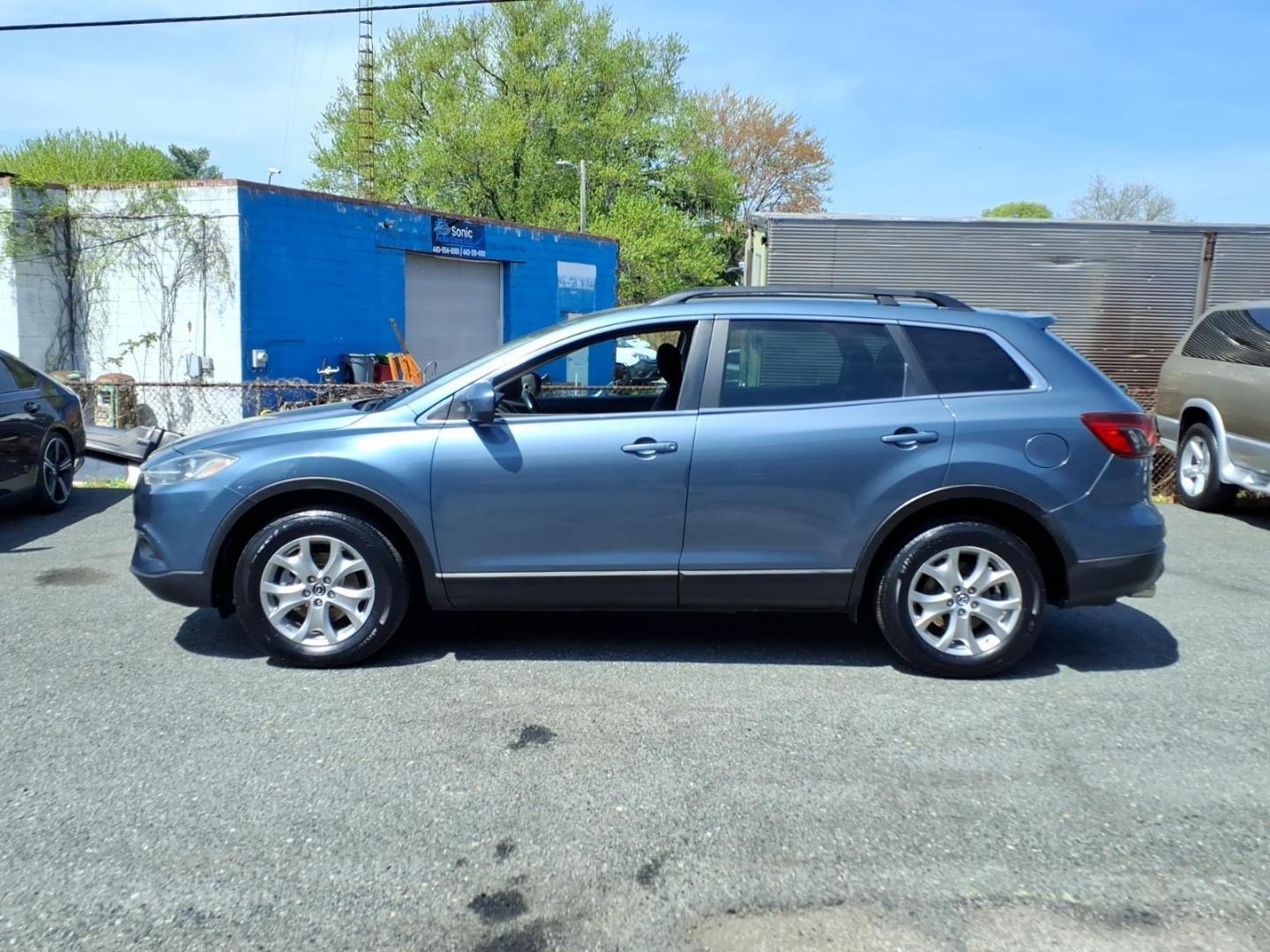 2015 Blue Mazda CX-9 Touring (JM3TB3CV1F0) with an 3.7L 6 Cylinder Fuel Injected engine, V6AT transmission, located at 50 Eastern Blvd., Essex, MD, 21221, (410) 686-3444, 39.304367, -76.484947 - Photo#1