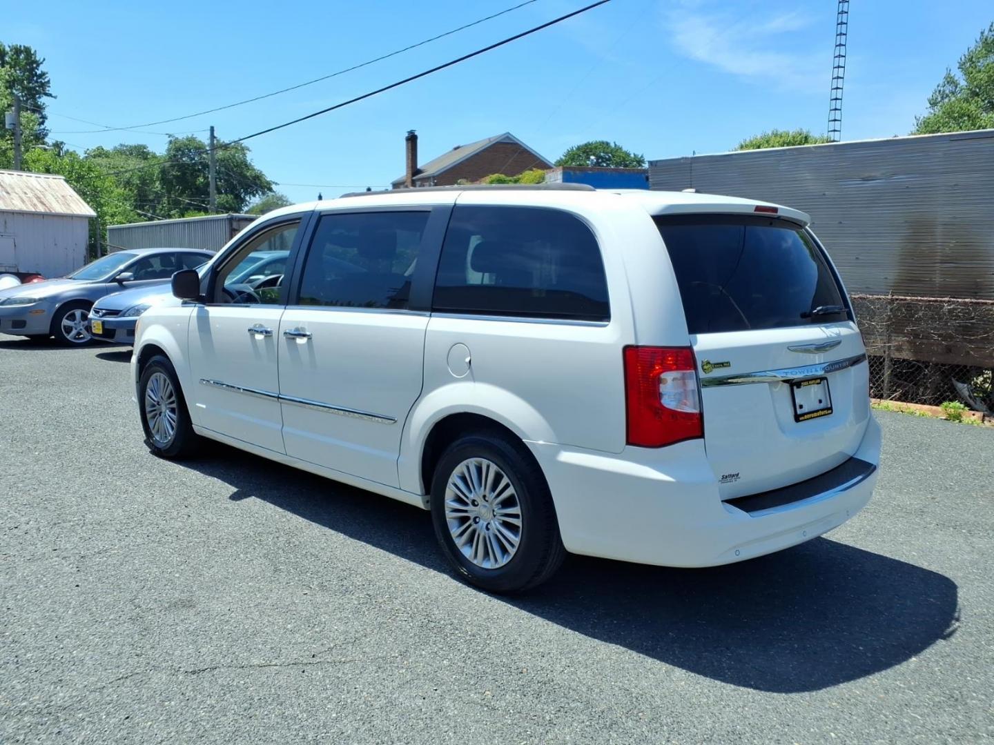 2013 White Chrysler Town and Country Touring-L (2C4RC1CG3DR) with an 3.6L 6 Cylinder Sequential-Port F.I. engine, AT V6 transmission, located at 50 Eastern Blvd., Essex, MD, 21221, (410) 686-3444, 39.304367, -76.484947 - Photo#2