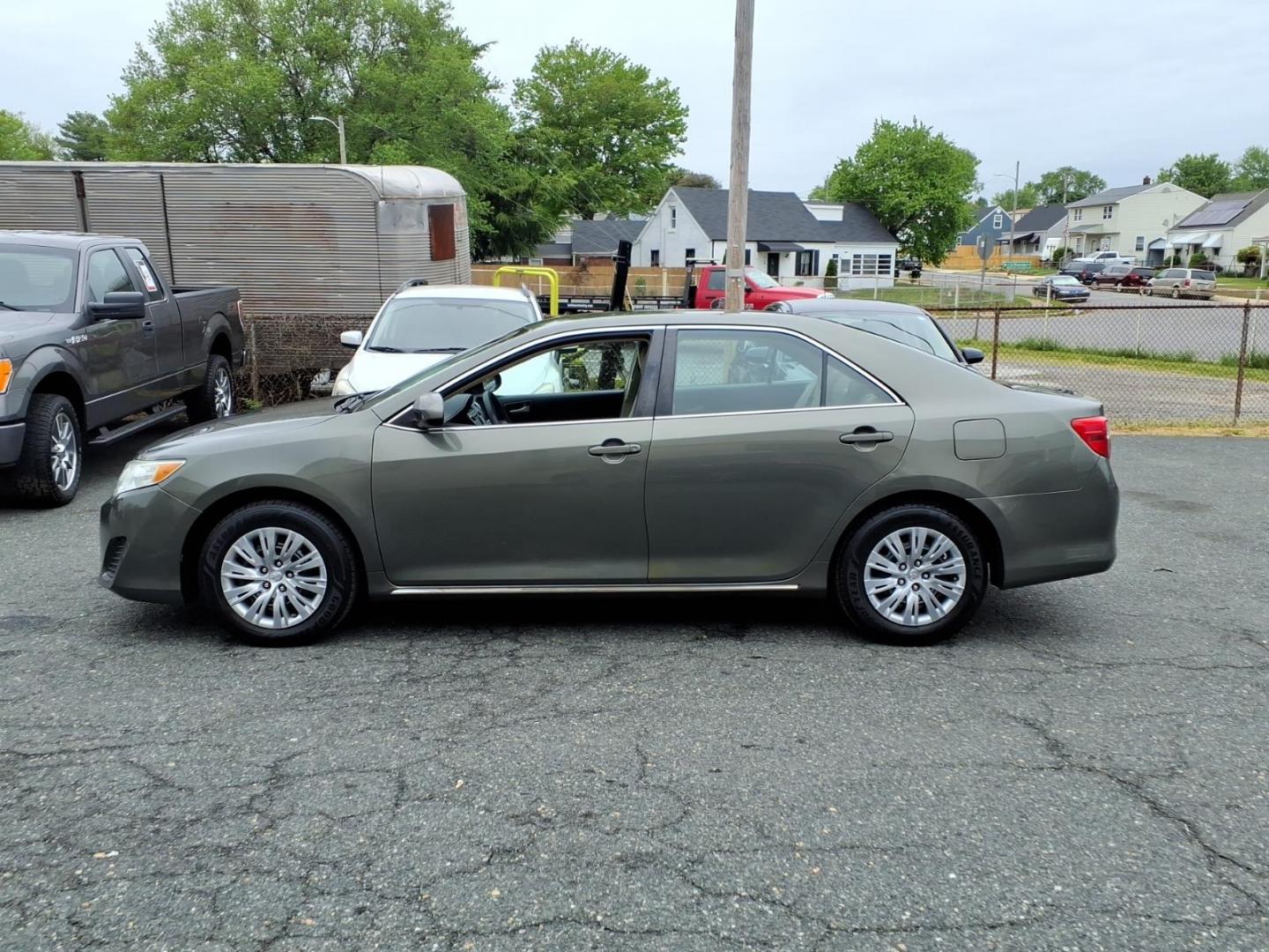 2014 Green Toyota Camry (4T4BF1FK3ER) with an 2.5L 4 Cylinder Sequential-Port F.I. engine, Automatic transmission, located at 50 Eastern Blvd., Essex, MD, 21221, (410) 686-3444, 39.304367, -76.484947 - Photo#1