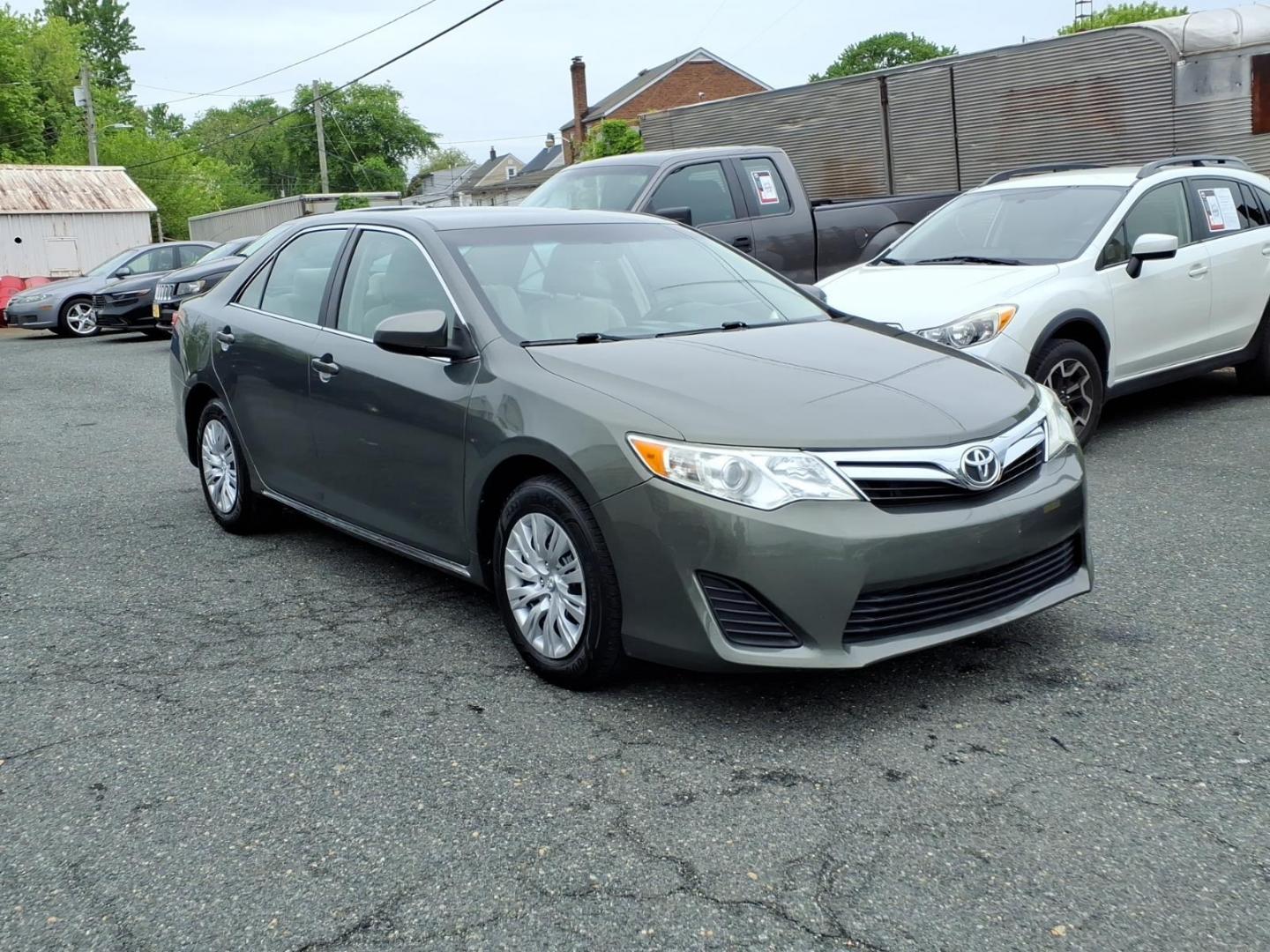 2014 Green Toyota Camry (4T4BF1FK3ER) with an 2.5L 4 Cylinder Sequential-Port F.I. engine, Automatic transmission, located at 50 Eastern Blvd., Essex, MD, 21221, (410) 686-3444, 39.304367, -76.484947 - Photo#5