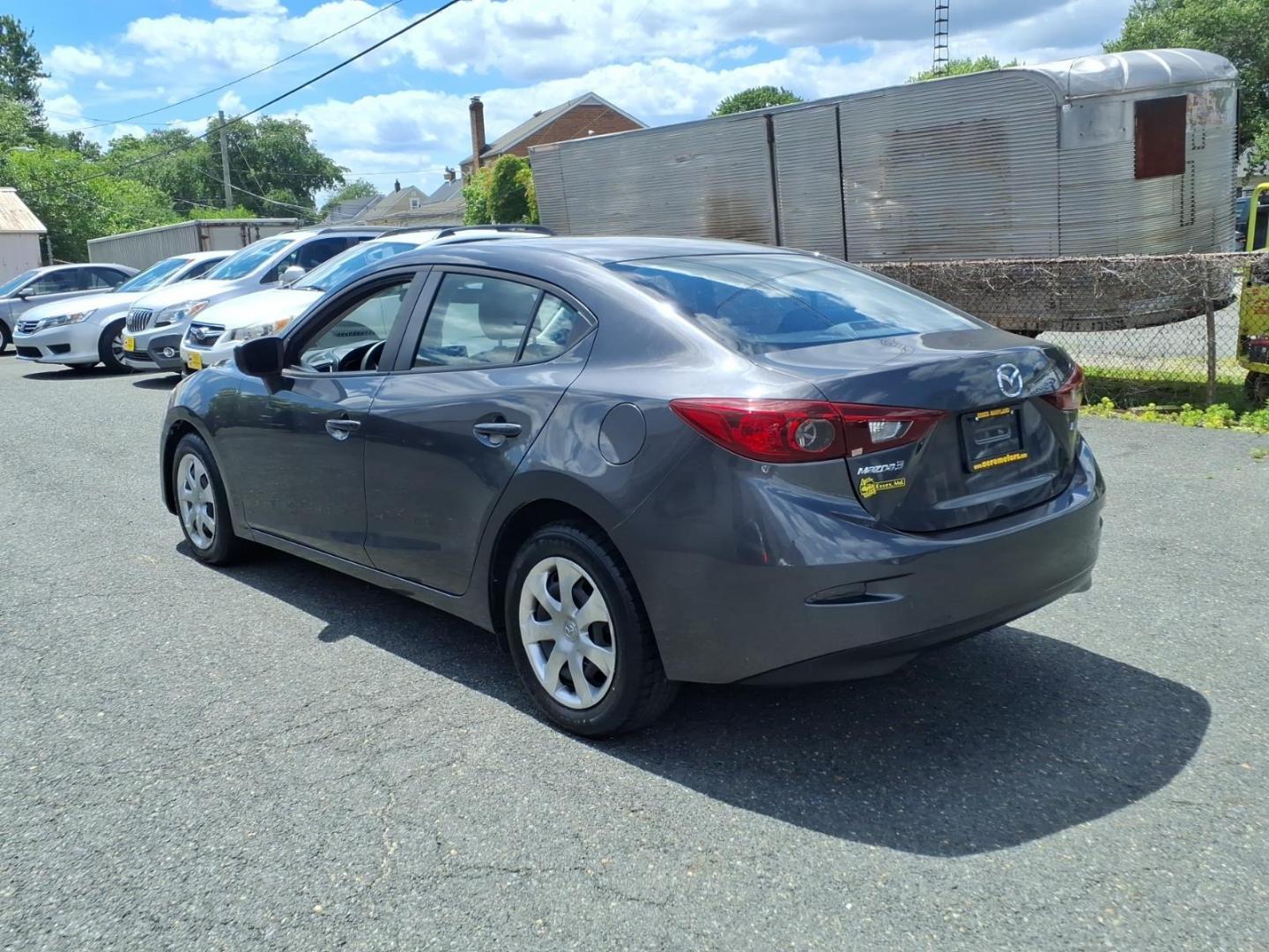 2014 Blue Mazda Mazda3 i Sport (JM1BM1U7XE1) with an 2.0L 4 Cylinder Fuel Injected engine, Automatic transmission, located at 50 Eastern Blvd., Essex, MD, 21221, (410) 686-3444, 39.304367, -76.484947- Photo#2