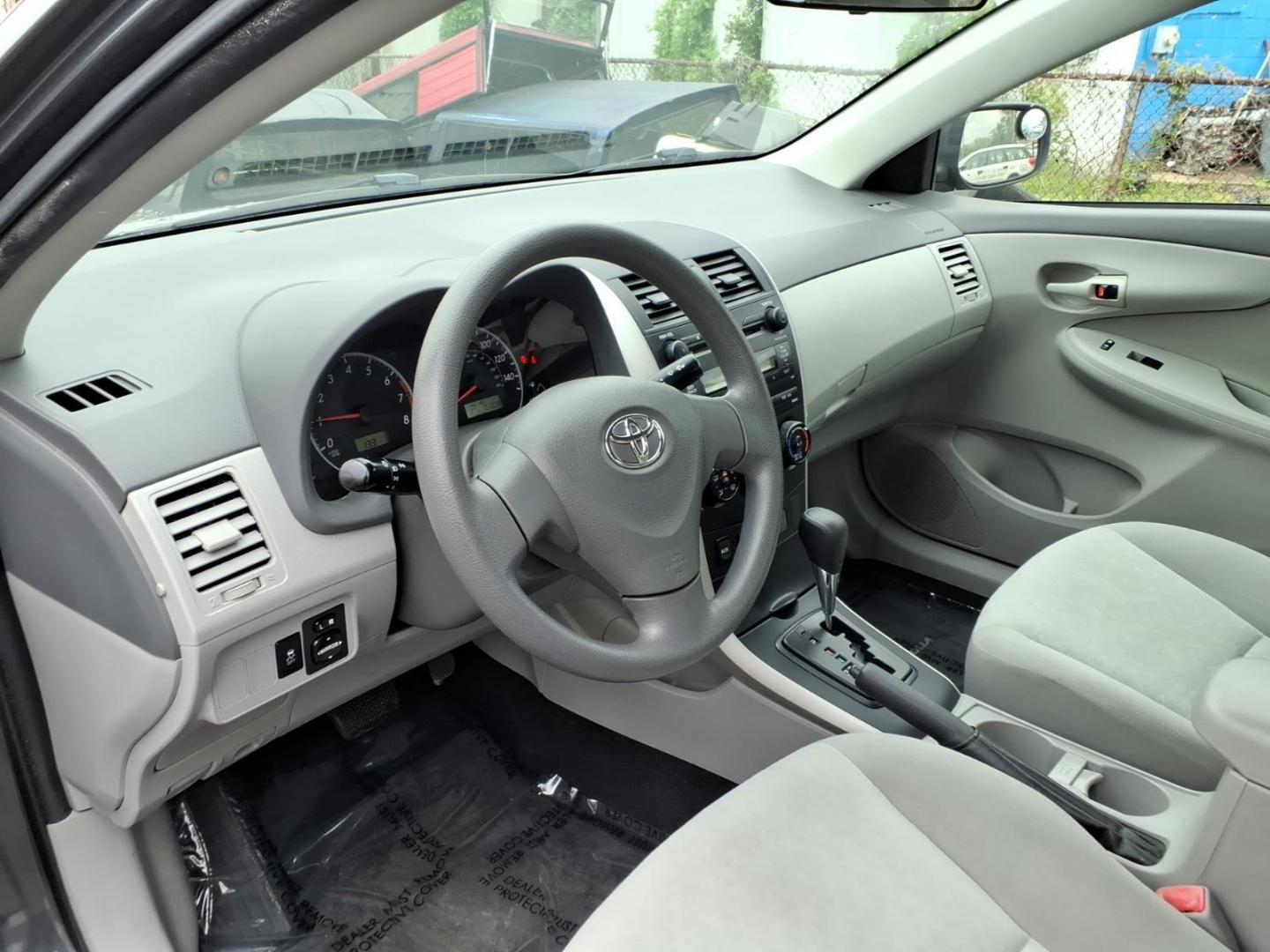 2009 Gray Toyota Corolla LE (2T1BU40E19C) with an 1.8L 1.8L I4 132hp 128ft. lbs. Sequential Fuel Injection engine, 4-Speed Automatic transmission, located at 50 Eastern Blvd., Essex, MD, 21221, (410) 686-3444, 39.304367, -76.484947 - Photo#8