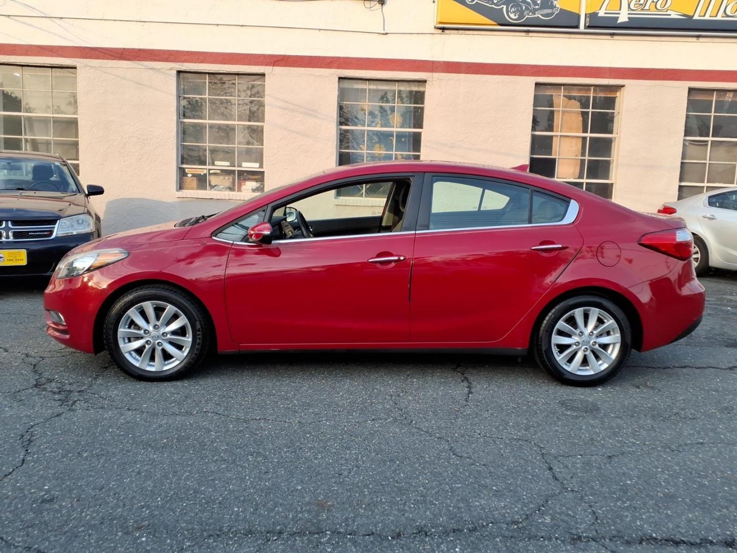 2015 Red Kia Forte EX (KNAFX4A8XF5) with an 2.0L 4 Cylinder Fuel Injected engine, 4CYL transmission, located at 50 Eastern Blvd., Essex, MD, 21221, (410) 686-3444, 39.304367, -76.484947 - Photo#1