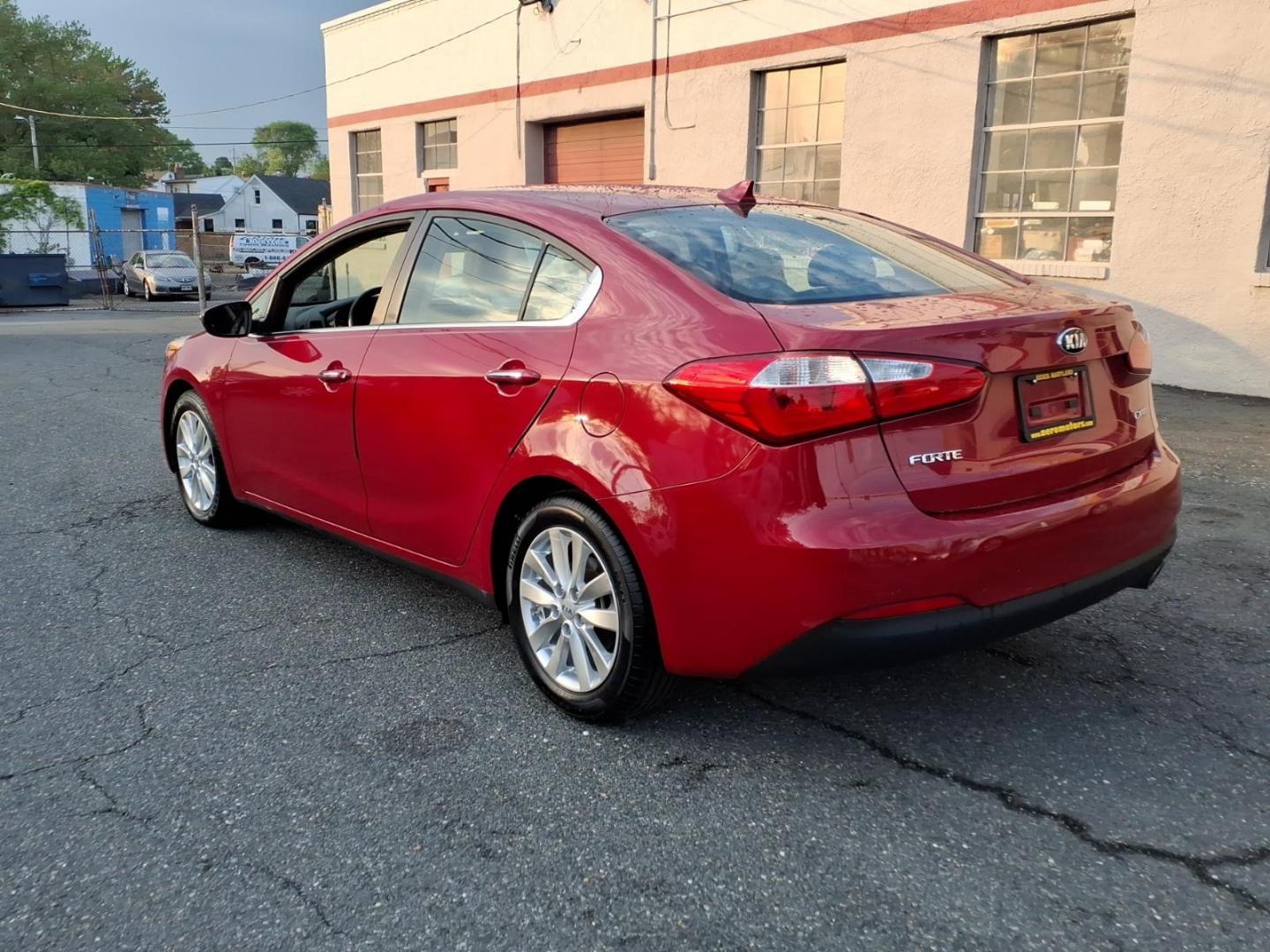 2015 Red Kia Forte EX (KNAFX4A8XF5) with an 2.0L 4 Cylinder Fuel Injected engine, 4CYL transmission, located at 50 Eastern Blvd., Essex, MD, 21221, (410) 686-3444, 39.304367, -76.484947 - Photo#2