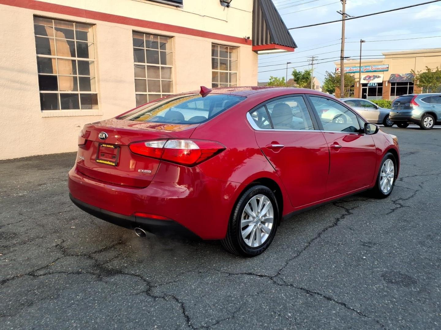 2015 Red Kia Forte EX (KNAFX4A8XF5) with an 2.0L 4 Cylinder Fuel Injected engine, 4CYL transmission, located at 50 Eastern Blvd., Essex, MD, 21221, (410) 686-3444, 39.304367, -76.484947 - Photo#4