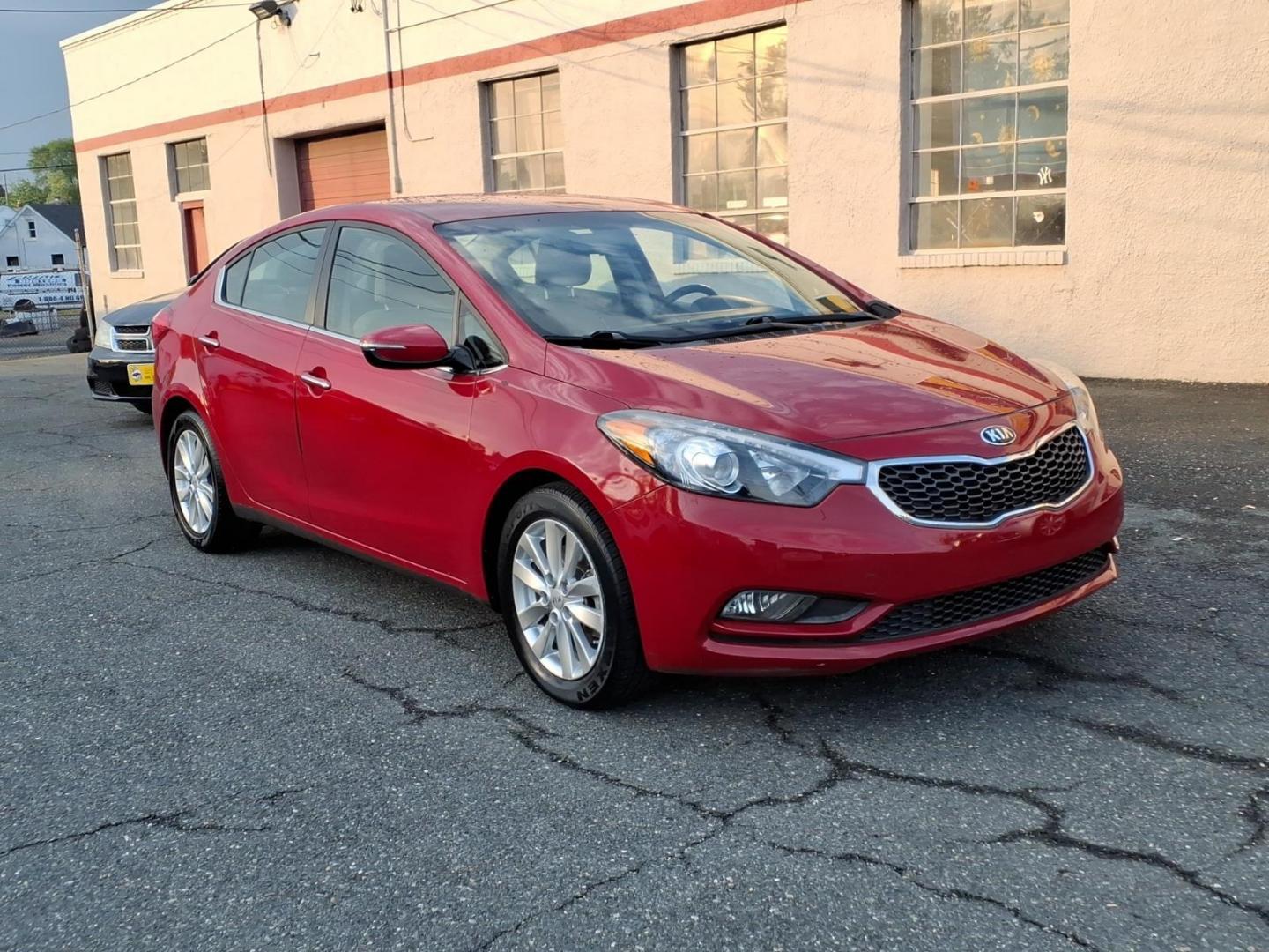 2015 Red Kia Forte EX (KNAFX4A8XF5) with an 2.0L 4 Cylinder Fuel Injected engine, 4CYL transmission, located at 50 Eastern Blvd., Essex, MD, 21221, (410) 686-3444, 39.304367, -76.484947 - Photo#6