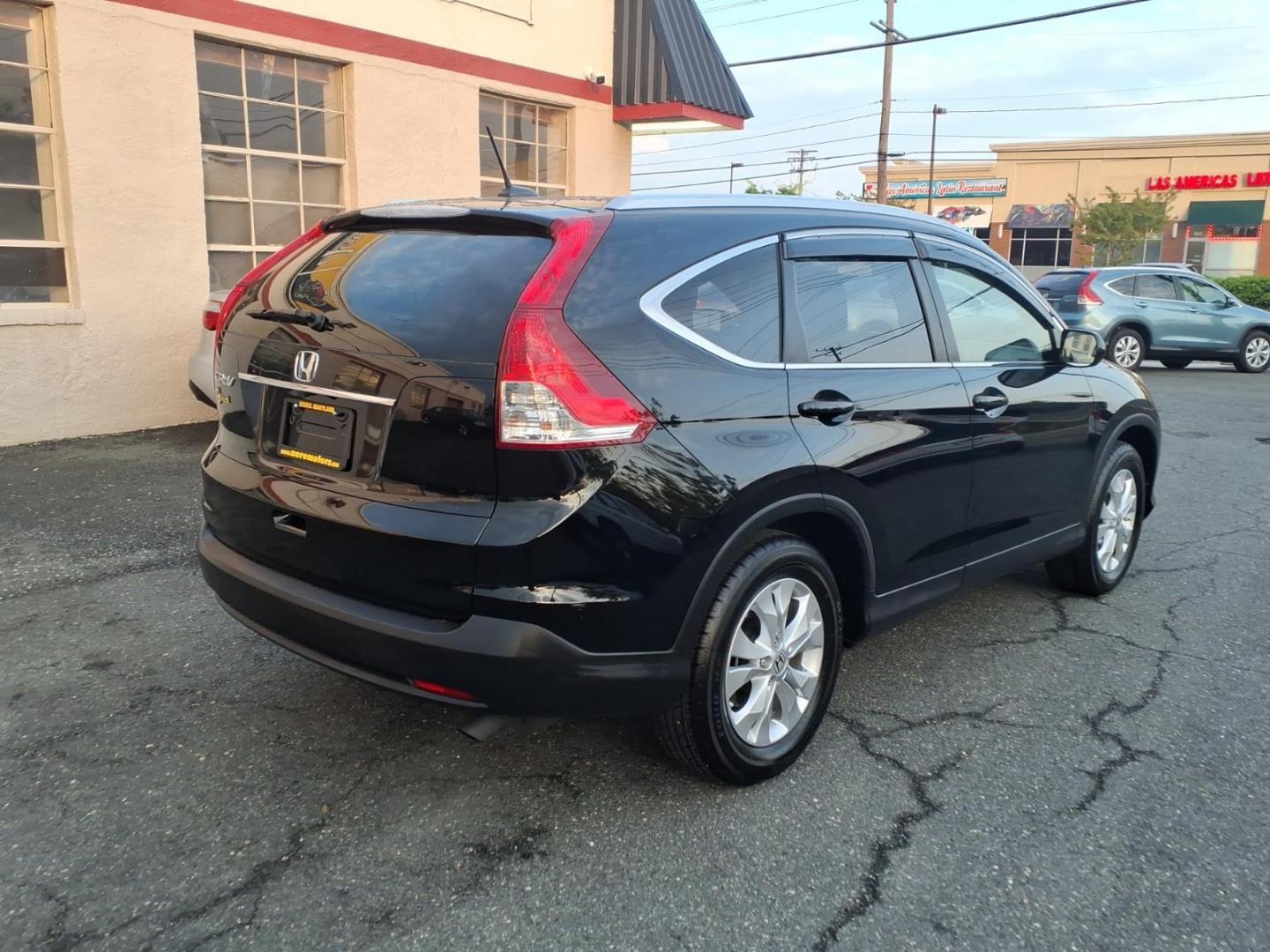 2012 Black Honda CR-V EX-L w/DVD (JHLRM3H79CC) with an 2.4L 2.4L I4 185hp 163ft. lbs. Sequential-Port F.I. engine, 5-Speed Automatic transmission, located at 50 Eastern Blvd., Essex, MD, 21221, (410) 686-3444, 39.304367, -76.484947 - Photo#4