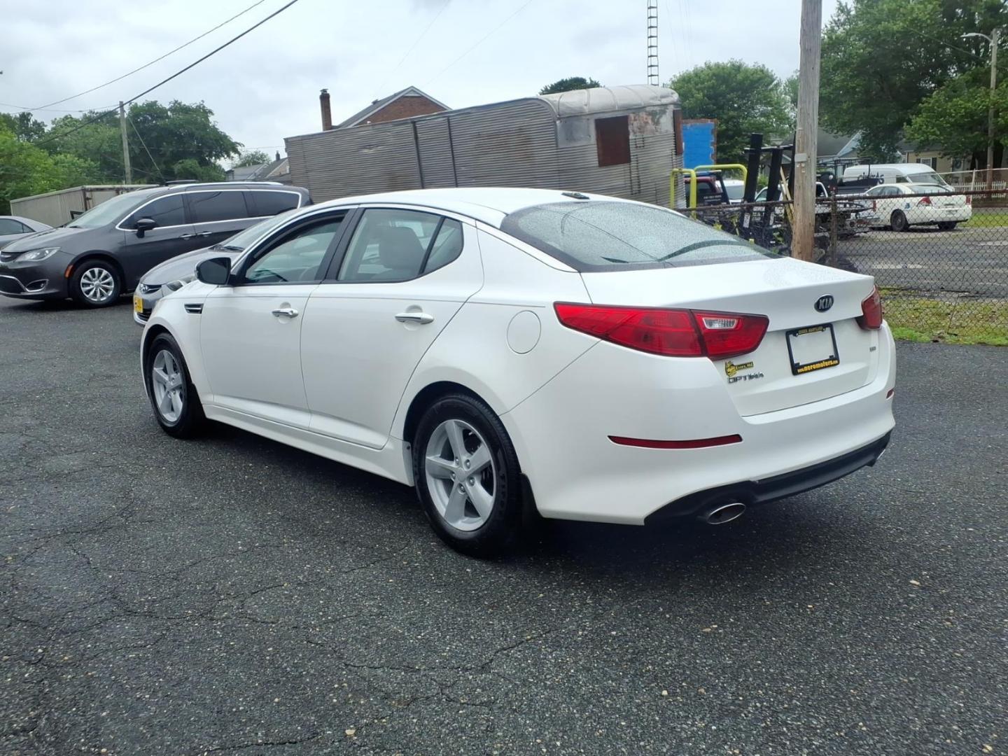 2015 White Kia Optima LX (KNAGM4A79F5) with an 2.4L 4 Cylinder Fuel Injected engine, Automatic transmission, located at 50 Eastern Blvd., Essex, MD, 21221, (410) 686-3444, 39.304367, -76.484947 - Photo#2