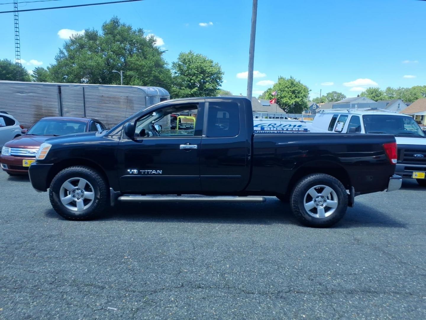 2006 Black Nissan Titan SE (1N6AA06B26N) with an 5.6L 5.6L V8 305hp 379ft. lbs. Fuel Injected engine, 5-Speed Shiftable Automatic transmission, located at 50 Eastern Blvd., Essex, MD, 21221, (410) 686-3444, 39.304367, -76.484947- Photo#1