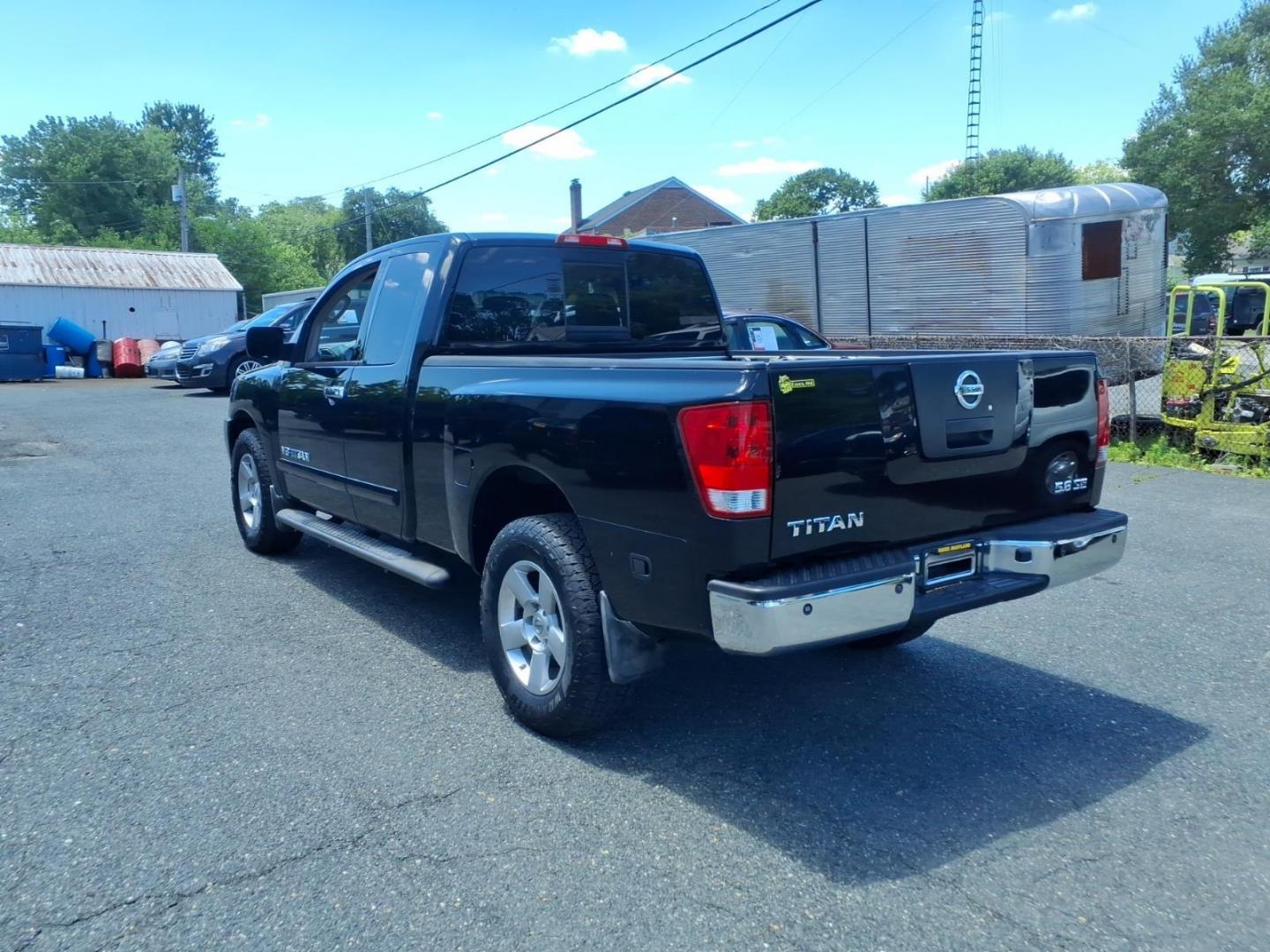 2006 Black Nissan Titan SE (1N6AA06B26N) with an 5.6L 5.6L V8 305hp 379ft. lbs. Fuel Injected engine, 5-Speed Shiftable Automatic transmission, located at 50 Eastern Blvd., Essex, MD, 21221, (410) 686-3444, 39.304367, -76.484947- Photo#2