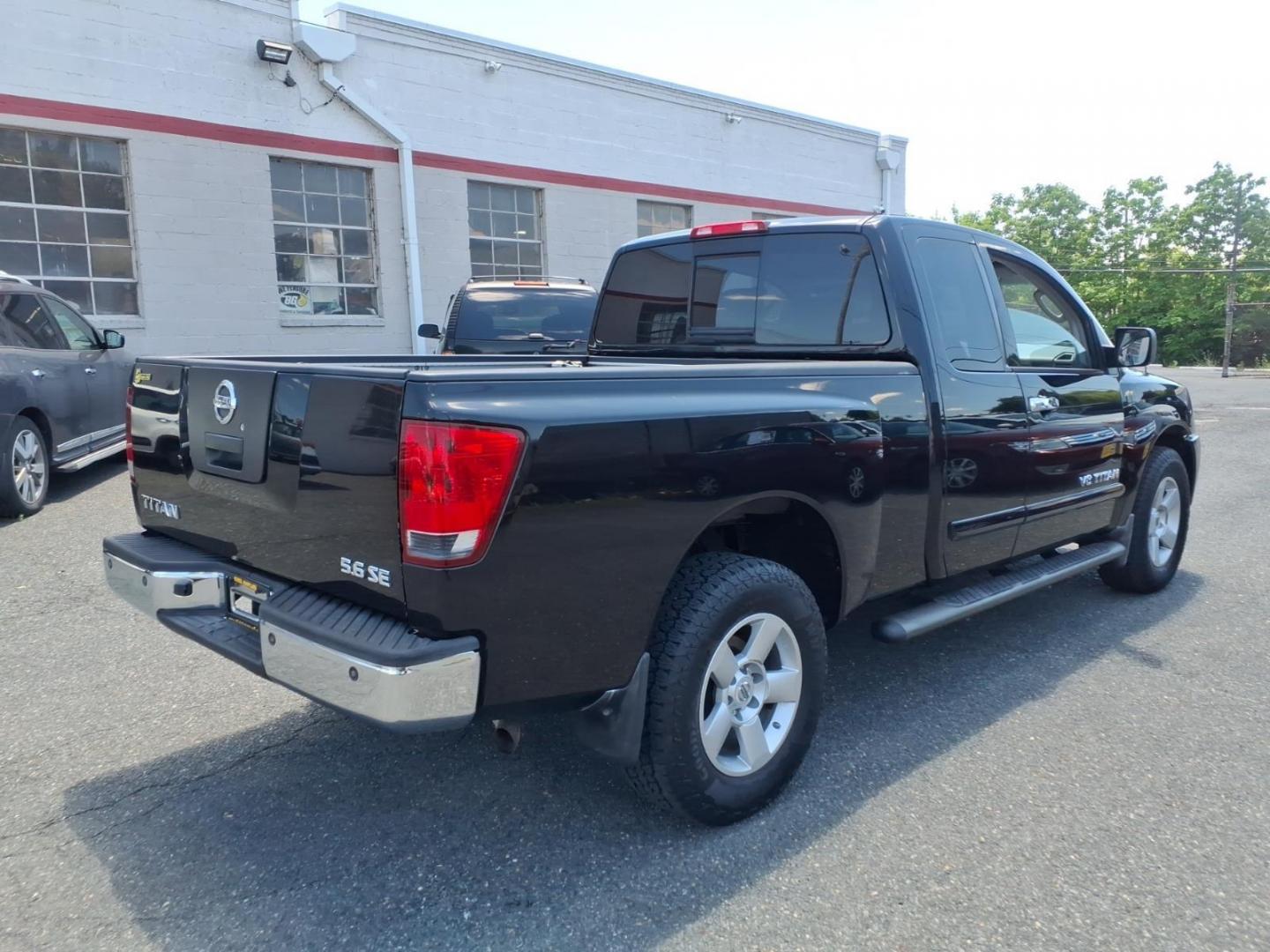 2006 Black Nissan Titan SE (1N6AA06B26N) with an 5.6L 5.6L V8 305hp 379ft. lbs. Fuel Injected engine, 5-Speed Shiftable Automatic transmission, located at 50 Eastern Blvd., Essex, MD, 21221, (410) 686-3444, 39.304367, -76.484947- Photo#4