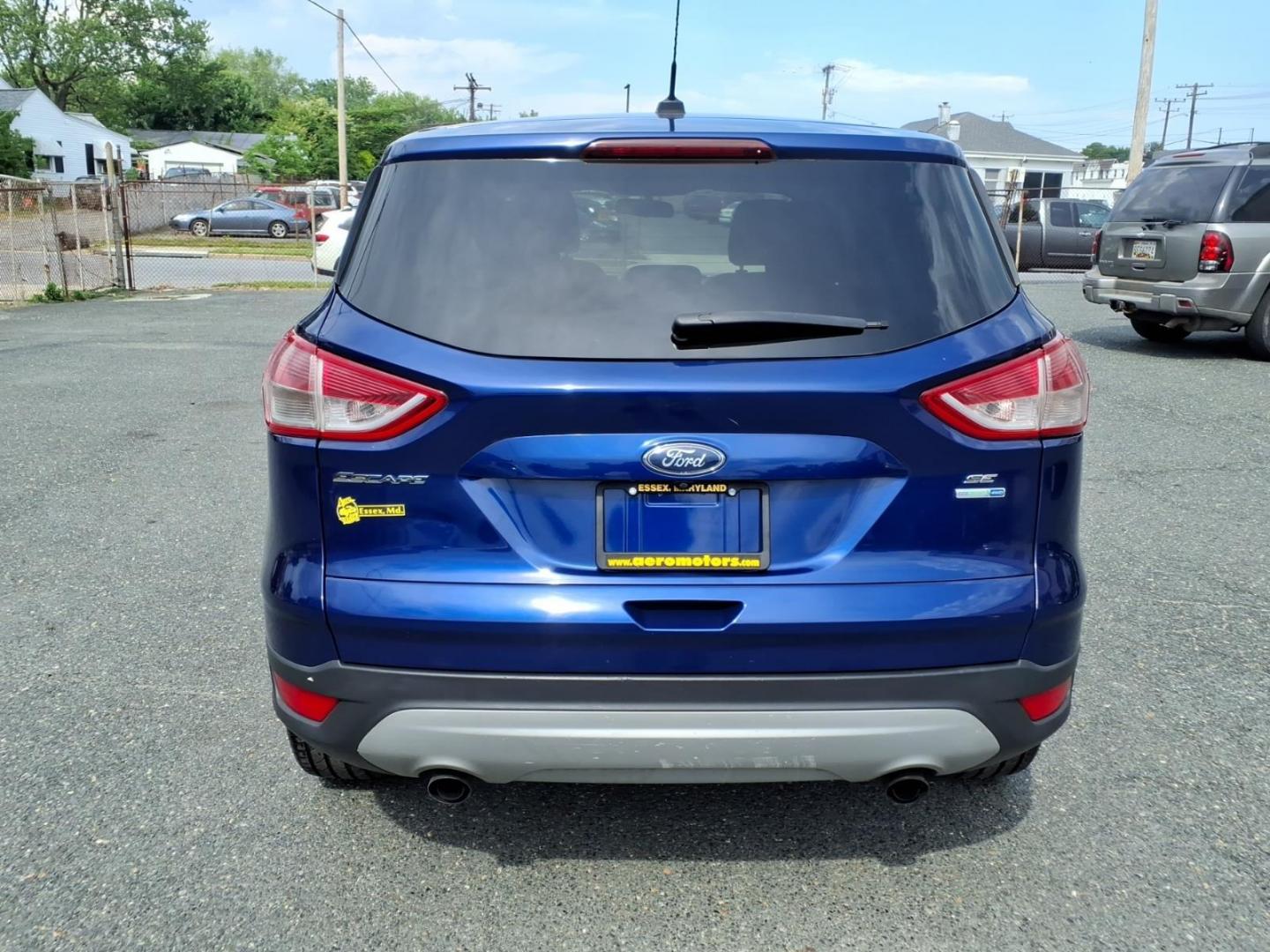 2014 Deep Impact Blue Metallic Ford Escape SE (1FMCU9G9XEU) with an 2.0L EcoBoost 2.0L Turbo I4 240hp 270ft. lbs. Turbocharged engine, 6-Speed Shiftable Automatic transmission, located at 50 Eastern Blvd., Essex, MD, 21221, (410) 686-3444, 39.304367, -76.484947 - Photo#3