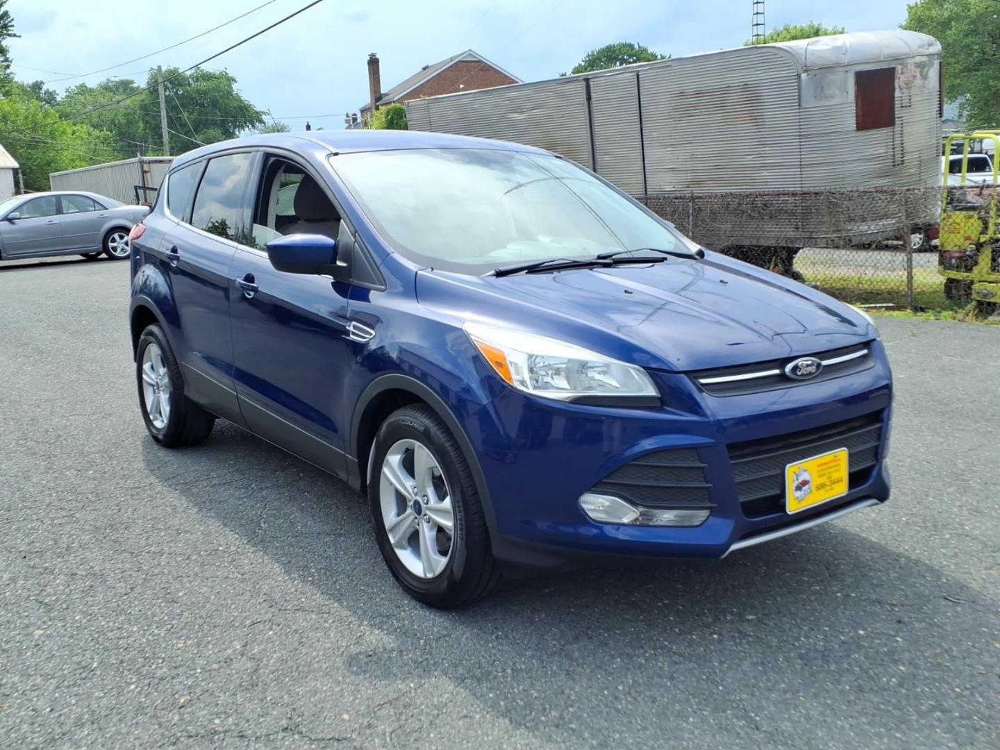2014 Deep Impact Blue Metallic Ford Escape SE (1FMCU9G9XEU) with an 2.0L EcoBoost 2.0L Turbo I4 240hp 270ft. lbs. Turbocharged engine, 6-Speed Shiftable Automatic transmission, located at 50 Eastern Blvd., Essex, MD, 21221, (410) 686-3444, 39.304367, -76.484947 - Photo#6