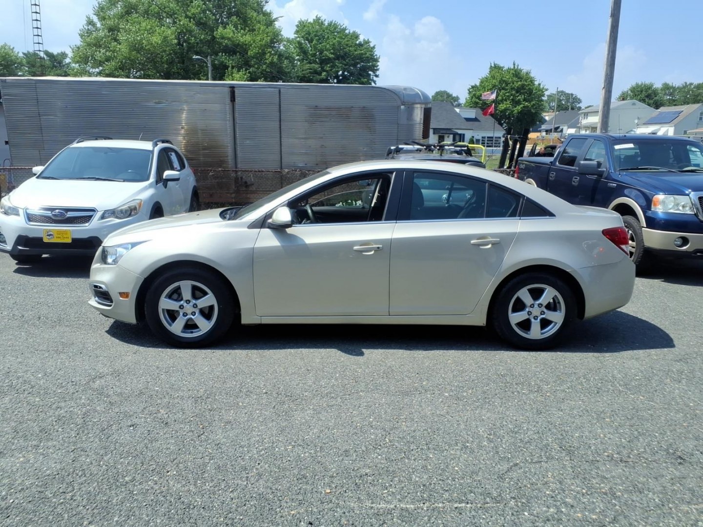 2015 Gold Chevrolet Cruze 1LT Auto (1G1PC5SB2F7) with an 1.4L 4 Cylinder Sequential-Port F.I. engine, Automatic transmission, located at 50 Eastern Blvd., Essex, MD, 21221, (410) 686-3444, 39.304367, -76.484947- Photo#1