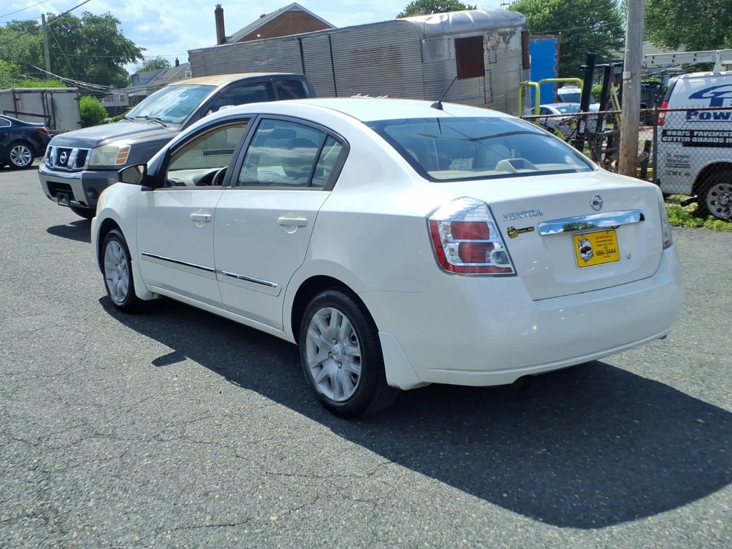 2010 White Nissan Sentra 2.0 (3N1AB6AP6AL) with an 2.0L 2.0L I4 140hp 147ft. lbs. Sequential-Port F.I. engine, CVT transmission, located at 50 Eastern Blvd., Essex, MD, 21221, (410) 686-3444, 39.304367, -76.484947- Photo#2