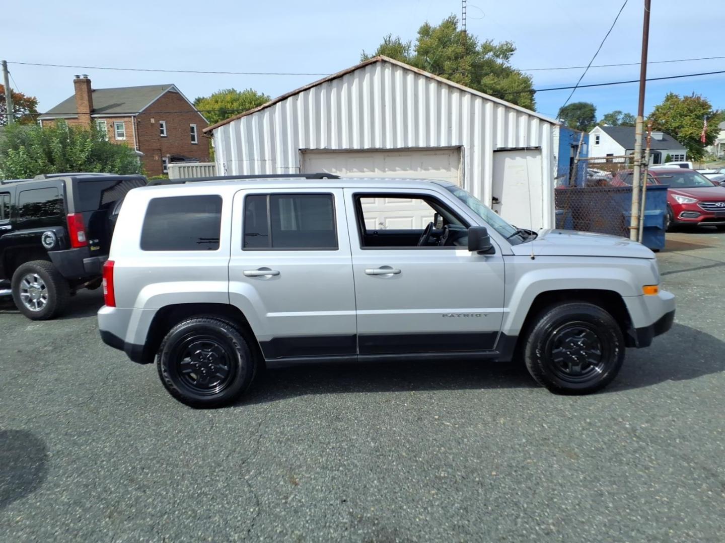 2014 Billet Silver Metallic Clear Coat Jeep Patriot Sport (1C4NJPBAXED) with an 2.0L 2.0L I4 158hp 141ft. lbs. Sequential-Port F.I. engine, Automatic transmission, located at 50 Eastern Blvd., Essex, MD, 21221, (410) 686-3444, 39.304367, -76.484947- Photo#4