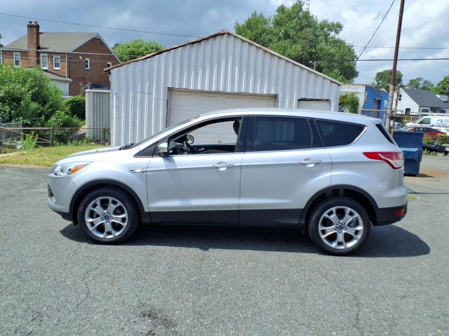 2013 Silver Ford Escape SEL (1FMCU0HX3DU) with an 1.6L 4 Cylinder Turbocharged engine, Automatic transmission, located at 50 Eastern Blvd., Essex, MD, 21221, (410) 686-3444, 39.304367, -76.484947- Photo#1