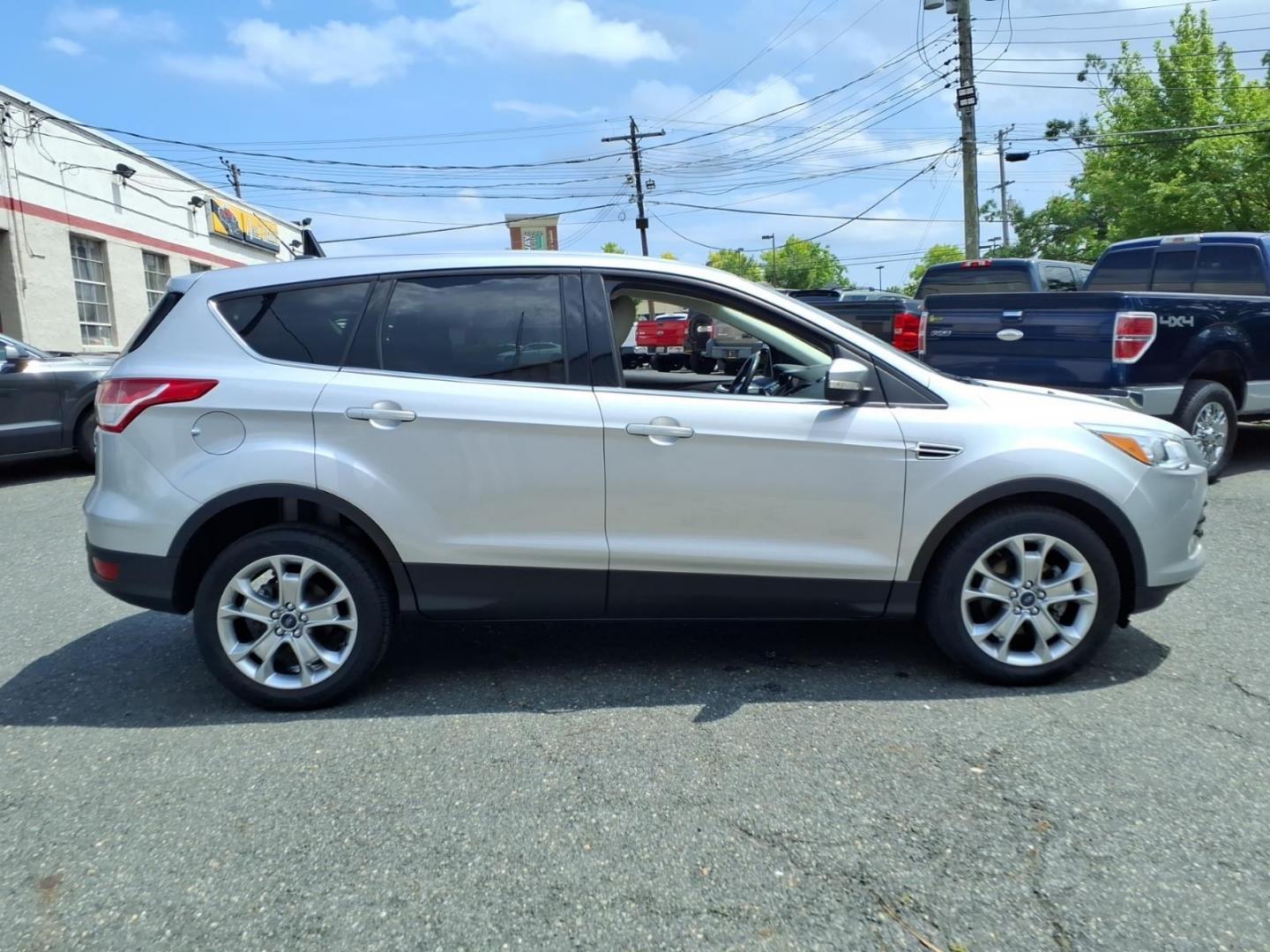 2013 Silver Ford Escape SEL (1FMCU0HX3DU) with an 1.6L 4 Cylinder Turbocharged engine, Automatic transmission, located at 50 Eastern Blvd., Essex, MD, 21221, (410) 686-3444, 39.304367, -76.484947- Photo#5