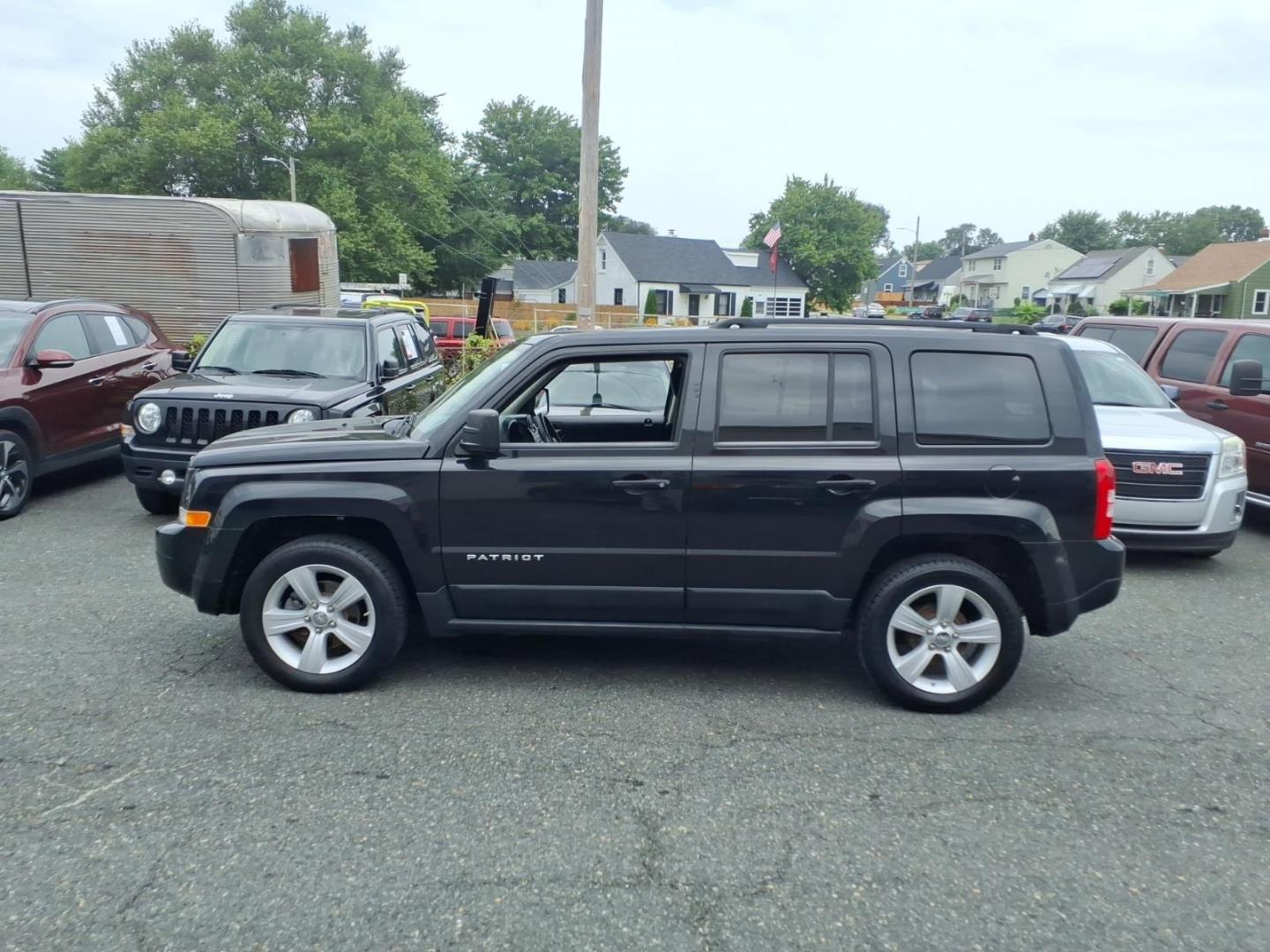 2011 Brilliant Black Crystal Pearl Coat Jeep Patriot Latitude (1J4NT1GA6BD) with an 2.0L 2.0L I4 158hp 141ft. lbs. Sequential-Port F.I. engine, Automatic transmission, located at 50 Eastern Blvd., Essex, MD, 21221, (410) 686-3444, 39.304367, -76.484947- Photo#1