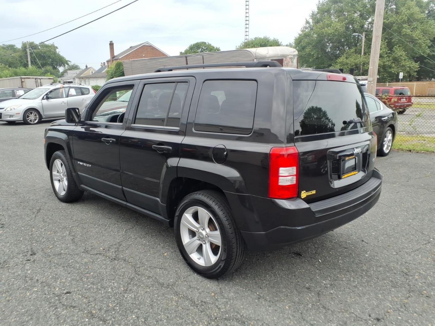2011 Brilliant Black Crystal Pearl Coat Jeep Patriot Latitude (1J4NT1GA6BD) with an 2.0L 2.0L I4 158hp 141ft. lbs. Sequential-Port F.I. engine, Automatic transmission, located at 50 Eastern Blvd., Essex, MD, 21221, (410) 686-3444, 39.304367, -76.484947- Photo#2